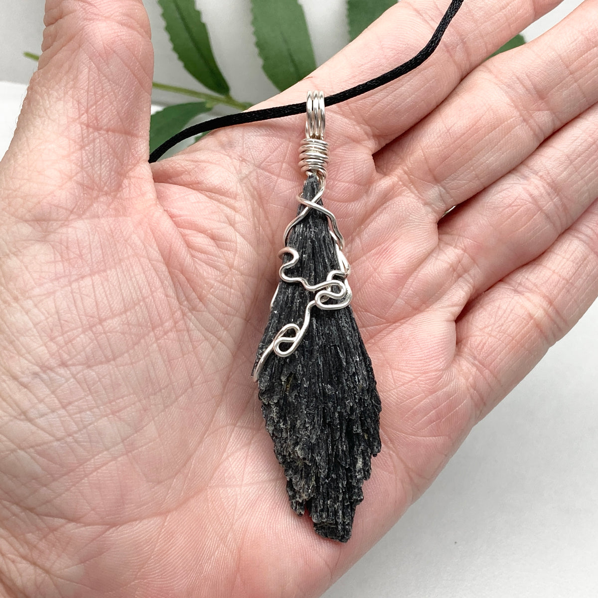 Black Kyanite necklace. Raw natural Kyanite wrapped with silver copper wire. Kyanite broom pendant. Black crystal jewelry. Comes on a black chain. Witchy gift.