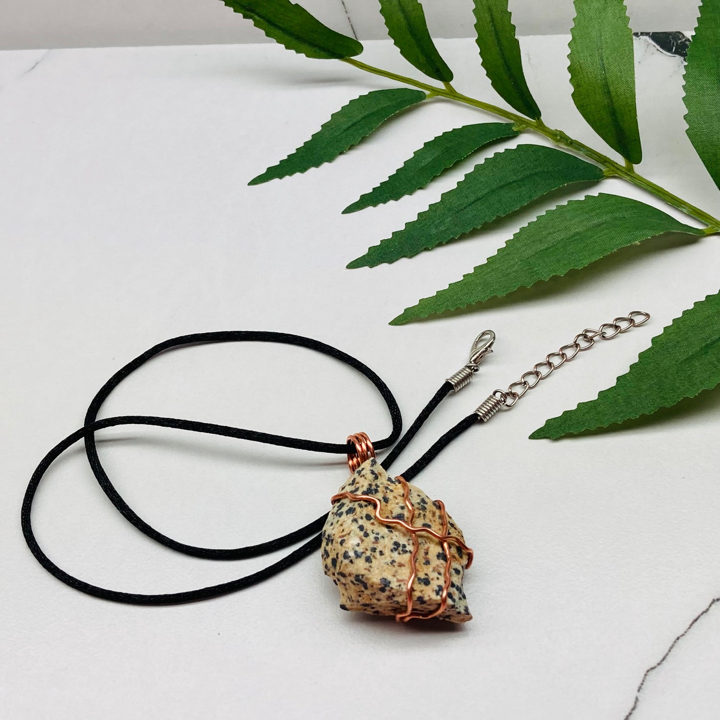 "Dalmatian jasper necklace with beige stone and black spots, wrapped in copper wire, handcrafted during the Moon in Aries