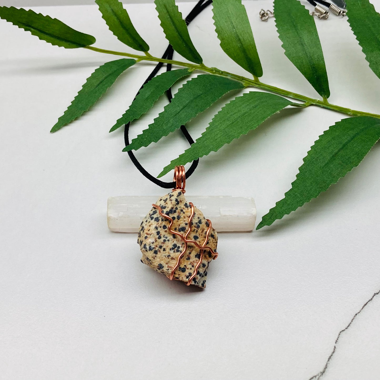 "Dalmatian jasper necklace with beige stone and black spots, wrapped in copper wire, handcrafted during the Moon in Aries