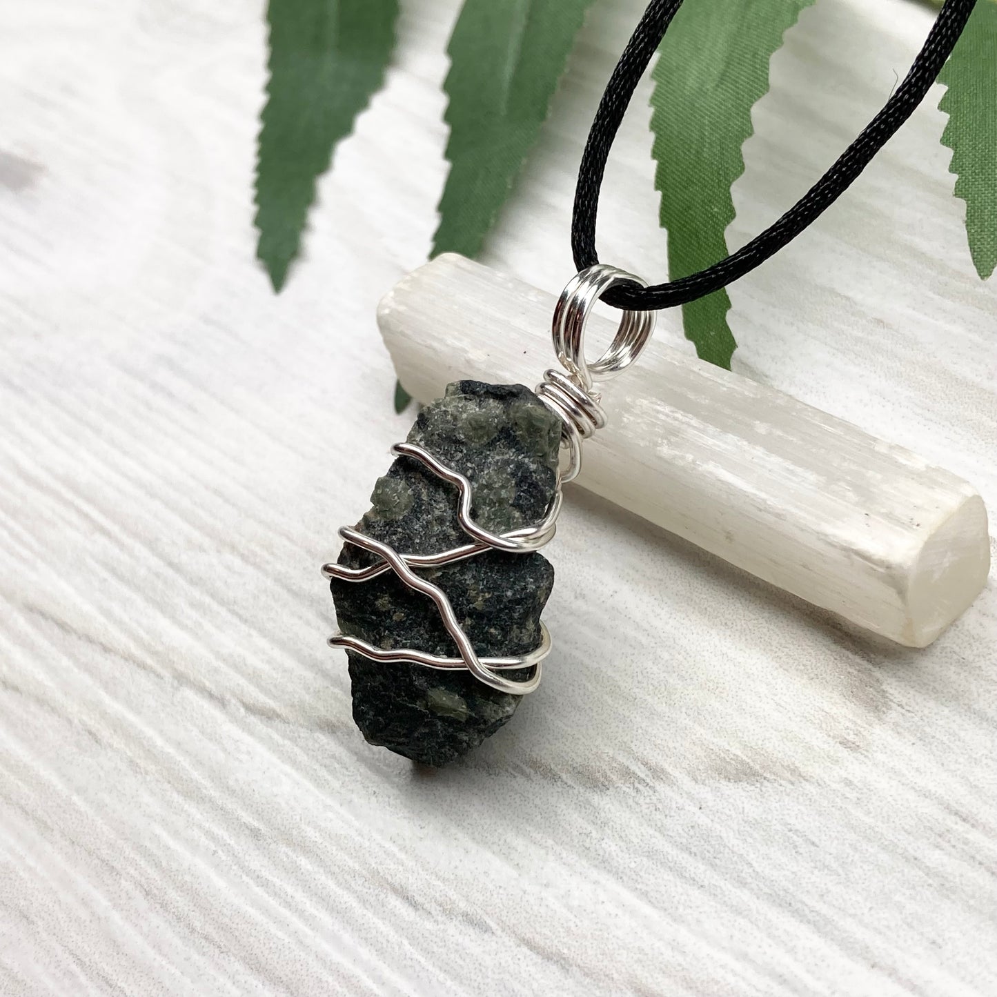 Kambaba Jasper necklace. Raw Kambaba Jasper stone wrapped with silver colored copper wire. Hangs on a black satin silk chain. Wire wrapped green and black crystal copper pendant. Handcrafted metaphysical jewelry.