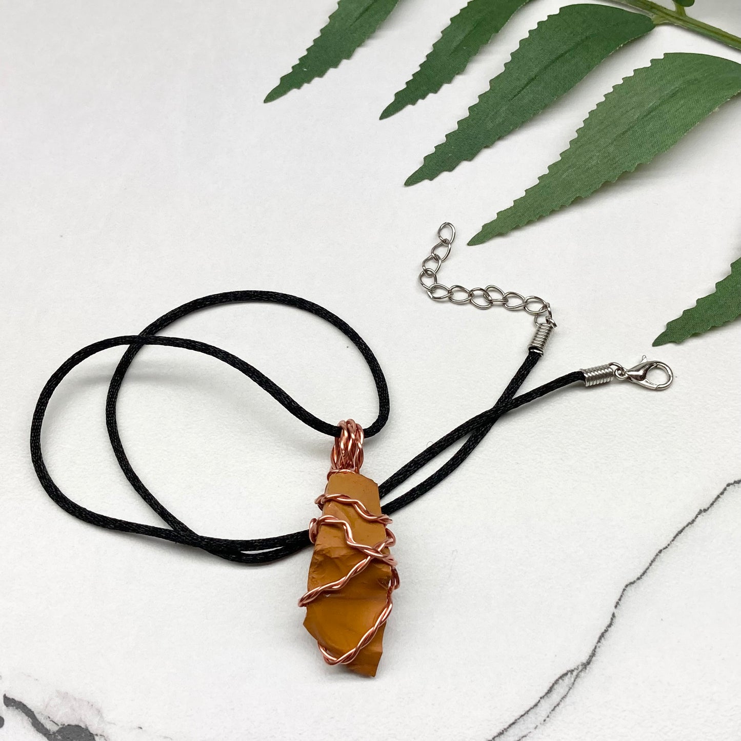 Natural Mookaite Jasper Necklace. Yellow Colored Raw Mookaite Crystal Wrapped With Pure Copper Wire. Comes On A Black Chain. Handmade Spiritual Gemstone Jewelry. Made In The USA.