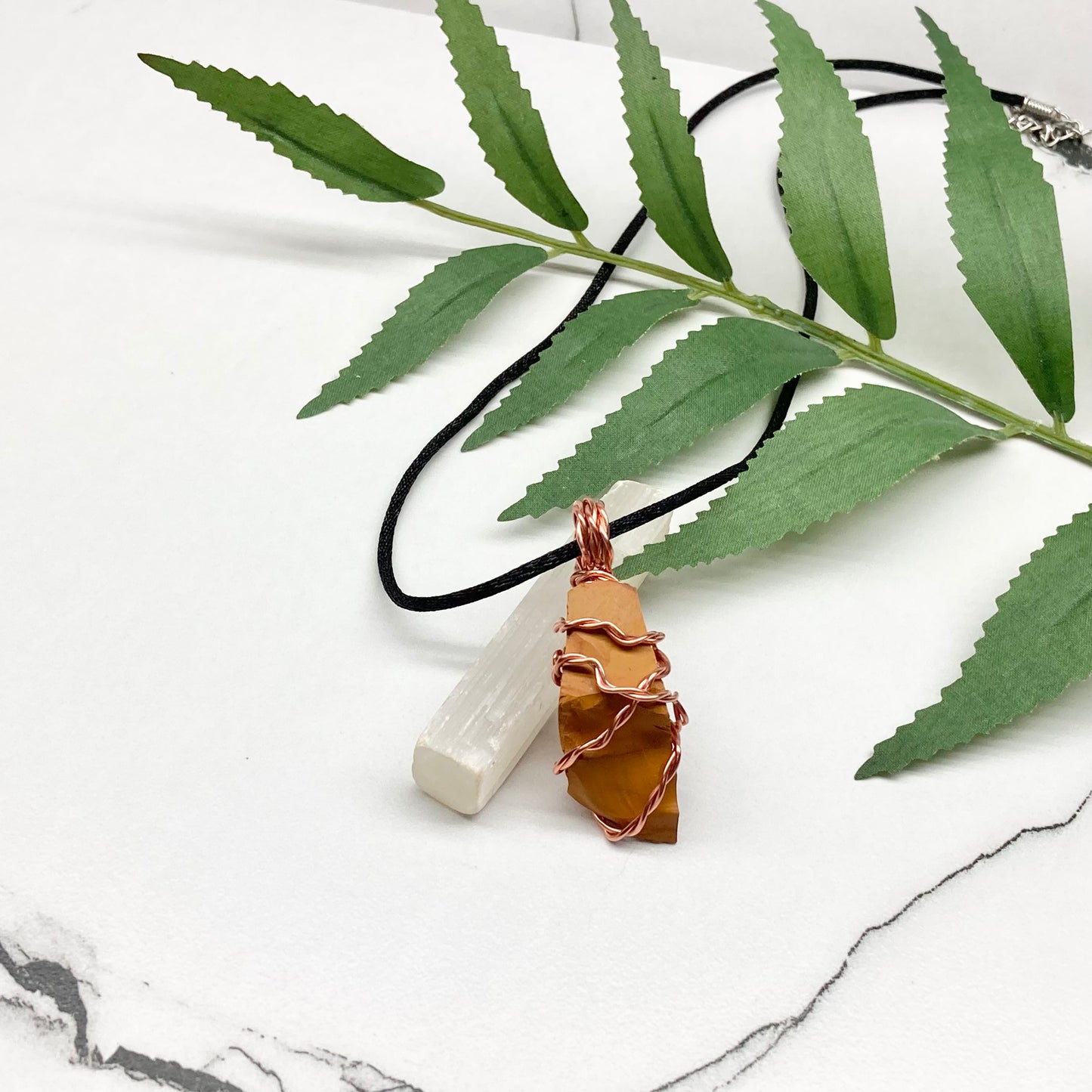 Natural Mookaite Jasper Necklace. Yellow Colored Raw Mookaite Crystal Wrapped With Pure Copper Wire. Comes On A Black Chain. Handmade Spiritual Gemstone Jewelry. Made In The USA.
