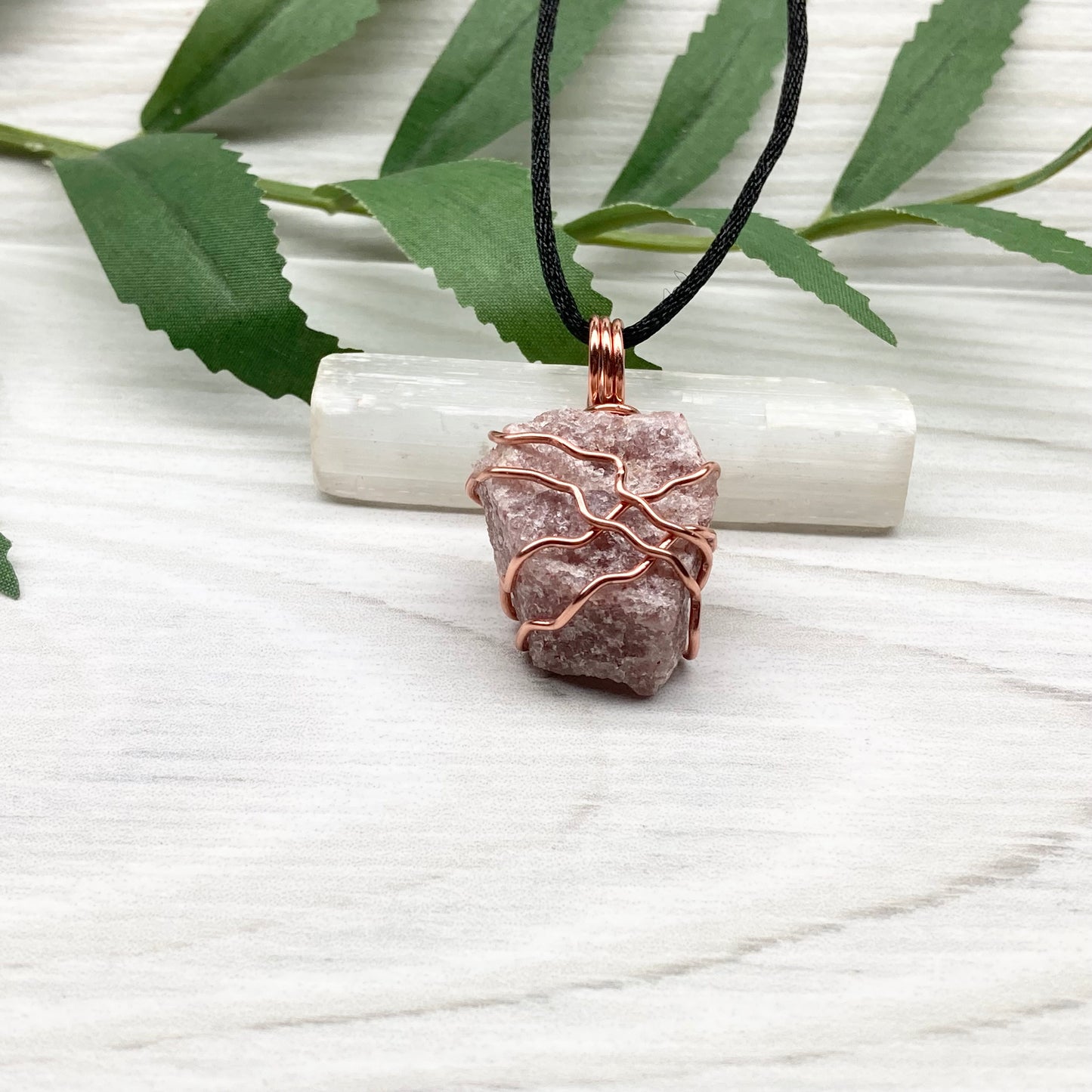 Pink Aventurine Necklace. Raw pink stone wrapped with tarnish resistant copper wire. Comes on a black chain. Wire wrapped crystal pendant. Heart chakra Jewelry.