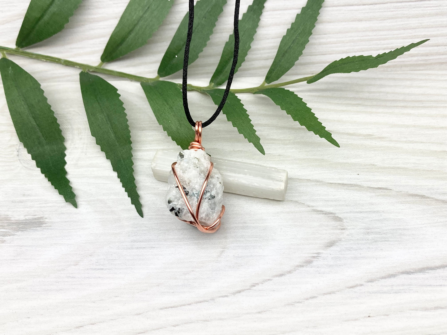 Rainbow Moonstone Necklace. White And Black Crystal Wrapped With Copper Wire. Comes On A Black Chain. This Stone Is Associated With The Third Eye Chakra.