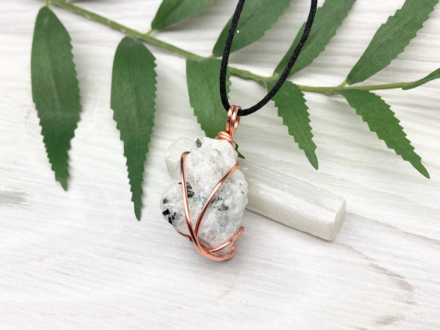 Rainbow Moonstone Necklace. White And Black Crystal Wrapped With Copper Wire. Comes On A Black Chain. This Stone Is Associated With The Third Eye Chakra.