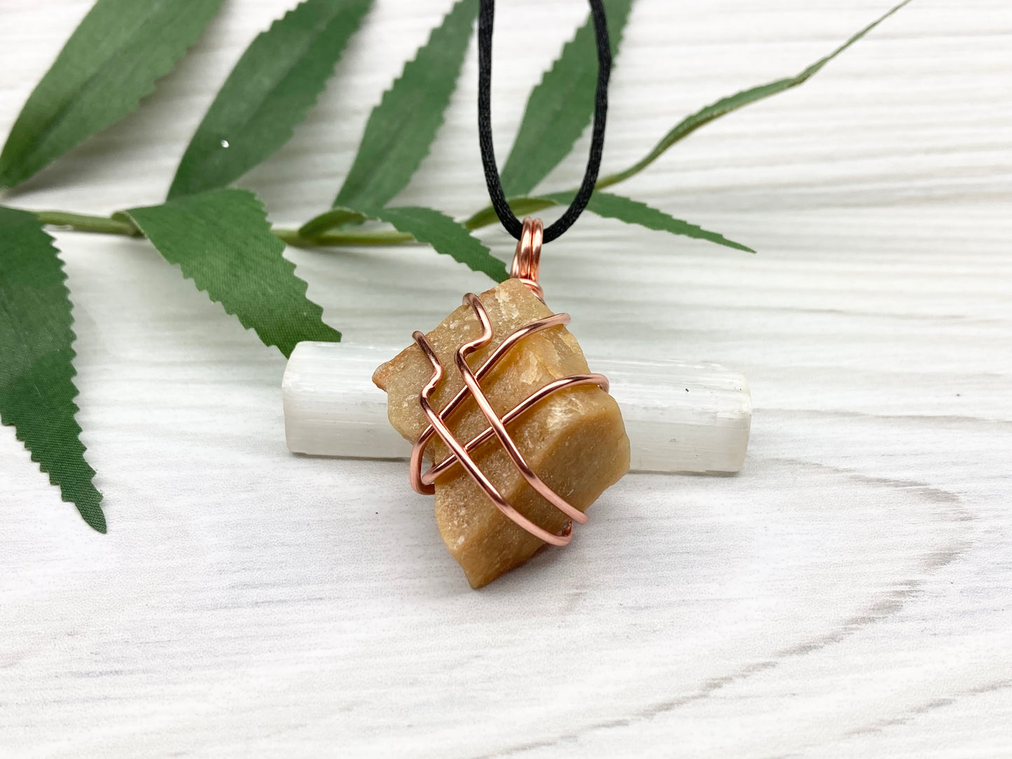 Yellow aventurine necklace. Yellow raw stone wrapped with copper wire. Comes on a black necklace. Handcrafted new age jewelry.