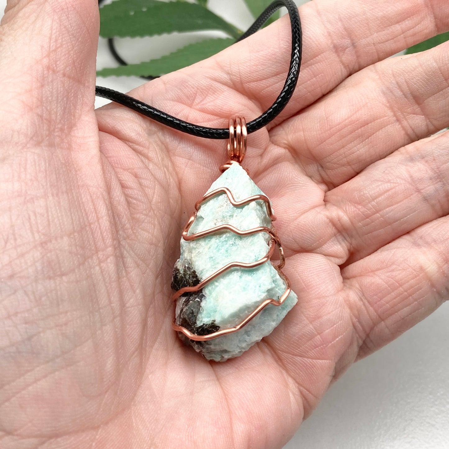 Amazonite necklace. Raw teal stone wrapped with copper wire. Hangs on a black chain. Real crystal pendant.