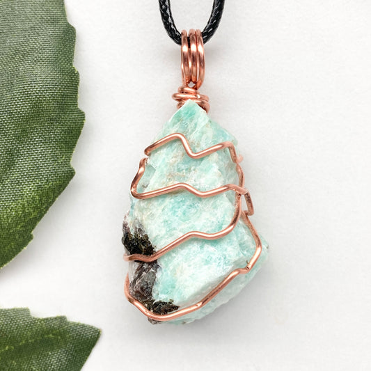 Amazonite necklace. Raw teal stone wrapped with copper wire. Hangs on a black chain. Real crystal pendant.