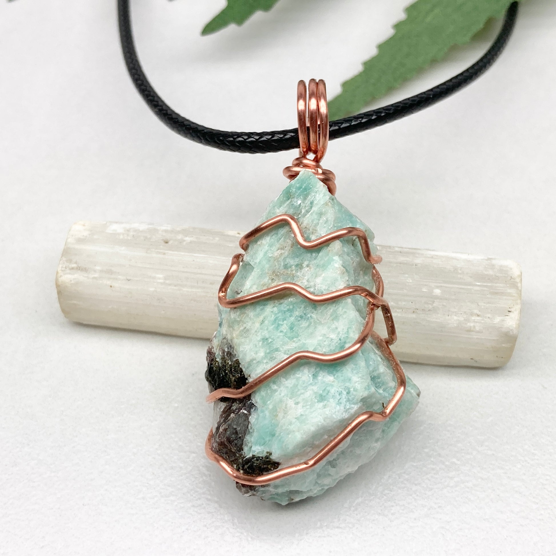 Amazonite necklace. Raw teal stone wrapped with copper wire. Hangs on a black chain. Real crystal pendant.