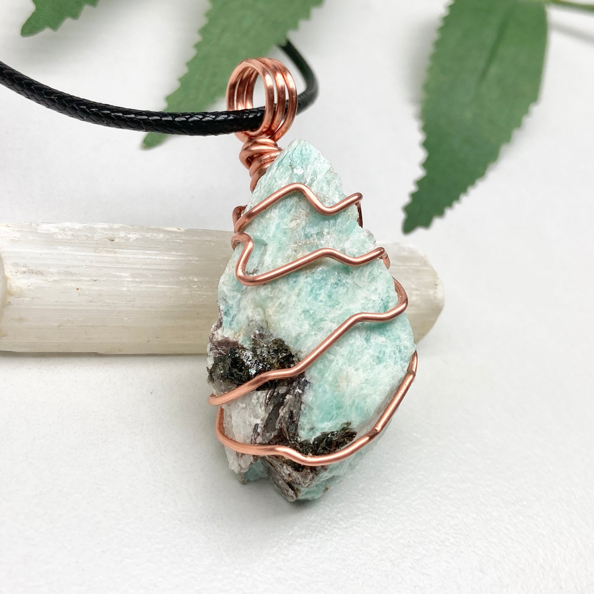 Amazonite necklace. Raw teal stone wrapped with copper wire. Hangs on a black chain. Real crystal pendant.