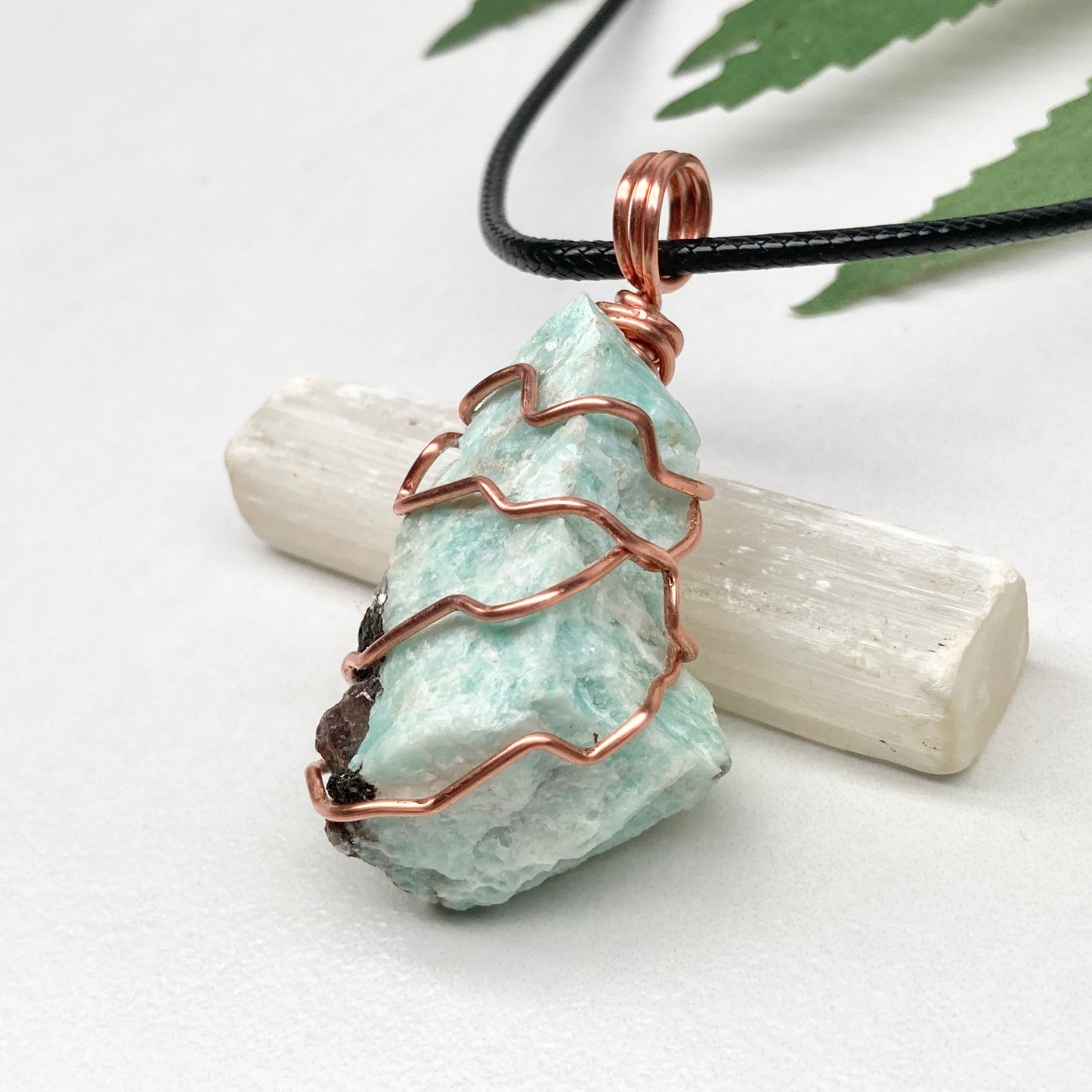 Amazonite necklace. Raw teal stone wrapped with copper wire. Hangs on a black chain. Real crystal pendant.