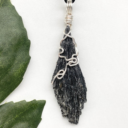 Black Kyanite necklace. Raw natural Kyanite wrapped with silver copper wire. Kyanite broom pendant. Black crystal jewelry. Comes on a black chain. Witchy gift.