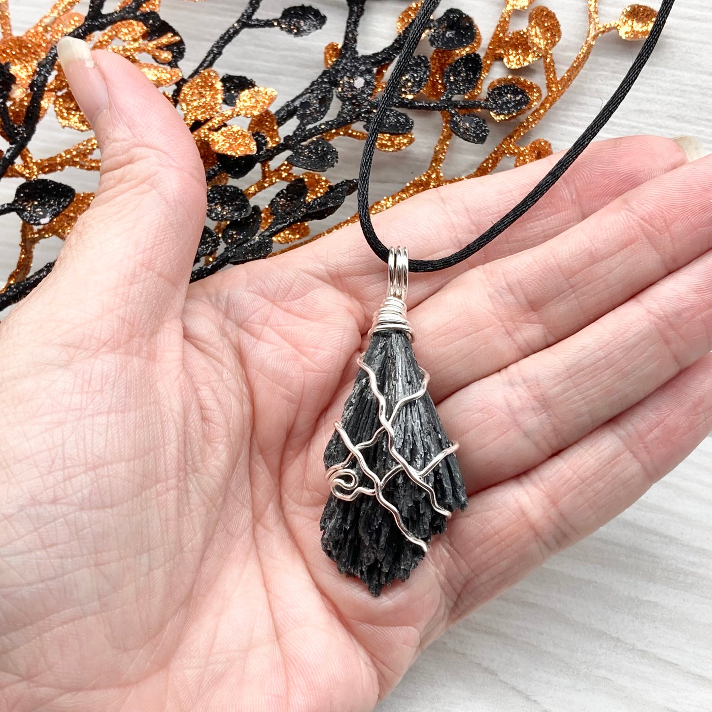 Black Kyanite necklace. Raw natural Kyanite wrapped with silver copper wire. Kyanite broom pendant. Black crystal jewelry. Comes on a black chain. Witchy gift.