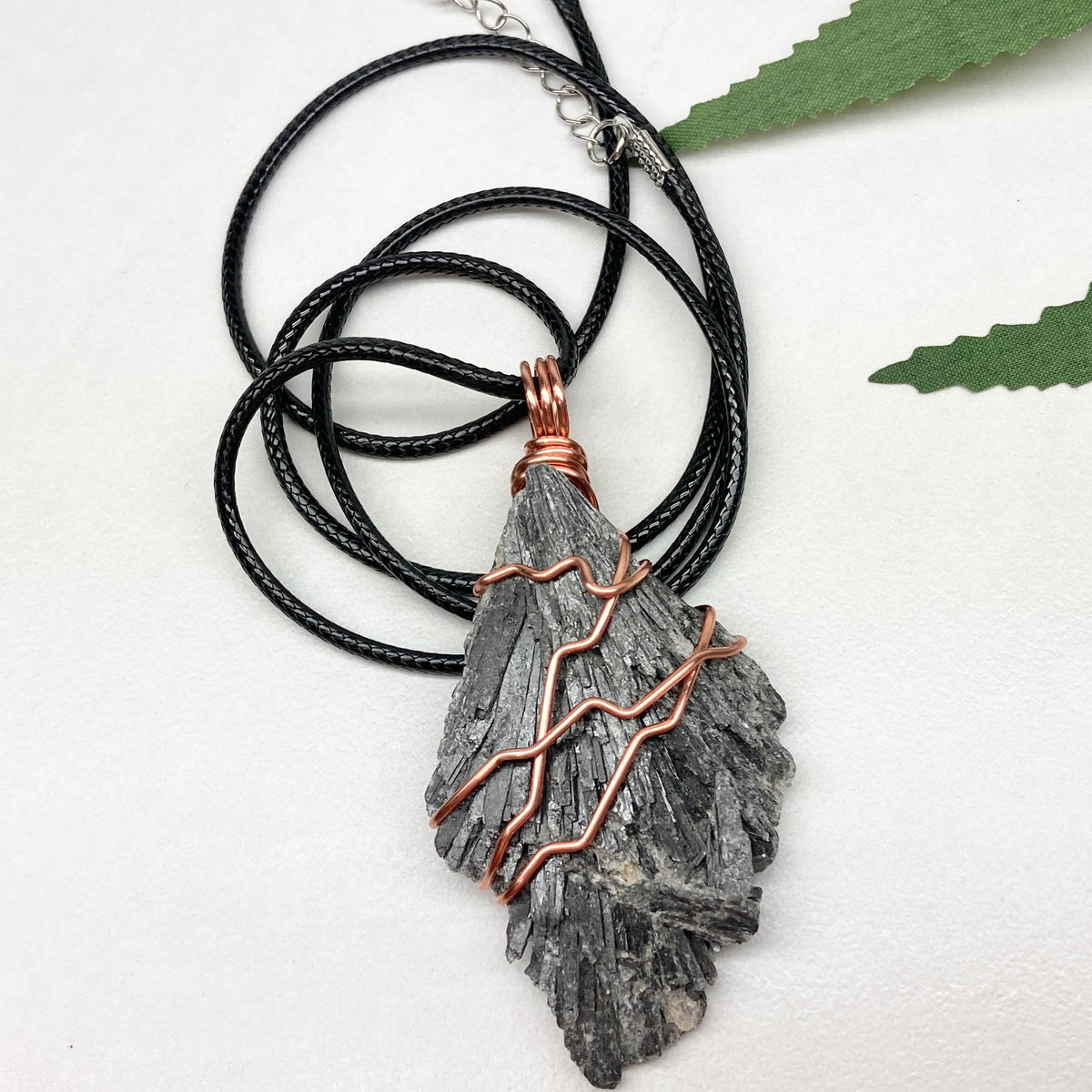 Black Kyanite necklace. Real raw Black Kyanite wrapped with 99.9% pure copper wire. Hangs on a black chain. Wire wrapped black crystal pendant. Spiritual gift.