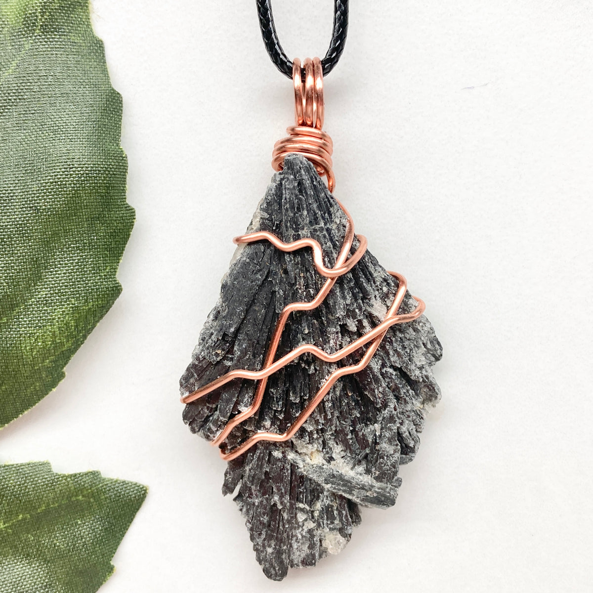 Black Kyanite necklace. Real raw Black Kyanite wrapped with 99.9% pure copper wire. Hangs on a black chain. Wire wrapped black crystal pendant. Spiritual gift.