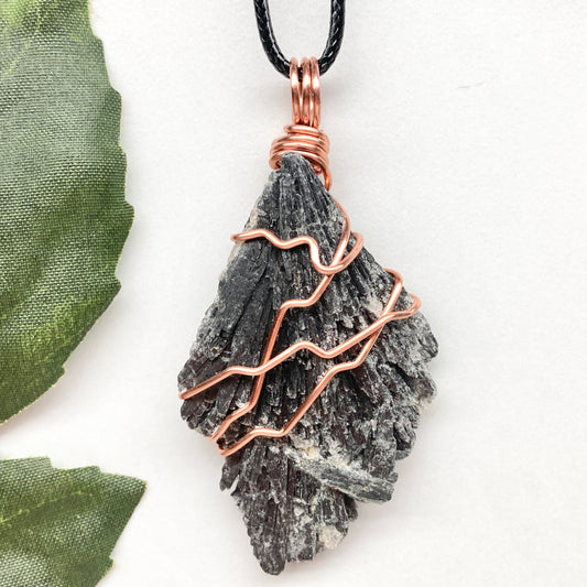 Black Kyanite necklace. Real raw Black Kyanite wrapped with 99.9% pure copper wire. Hangs on a black chain. Wire wrapped black crystal pendant. Spiritual gift.