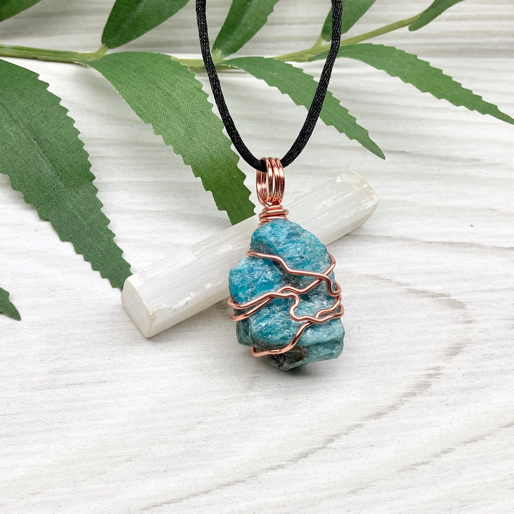 Blue Apatite Necklace. Raw Blue Apatite Stone Wrapped With Tarnish Resistant Copper Wire. This Pendant Was Handcrafted During The Moon In Scorpio. Comes On A Black Chain. Spiritual Jewelry For Him Or Her.