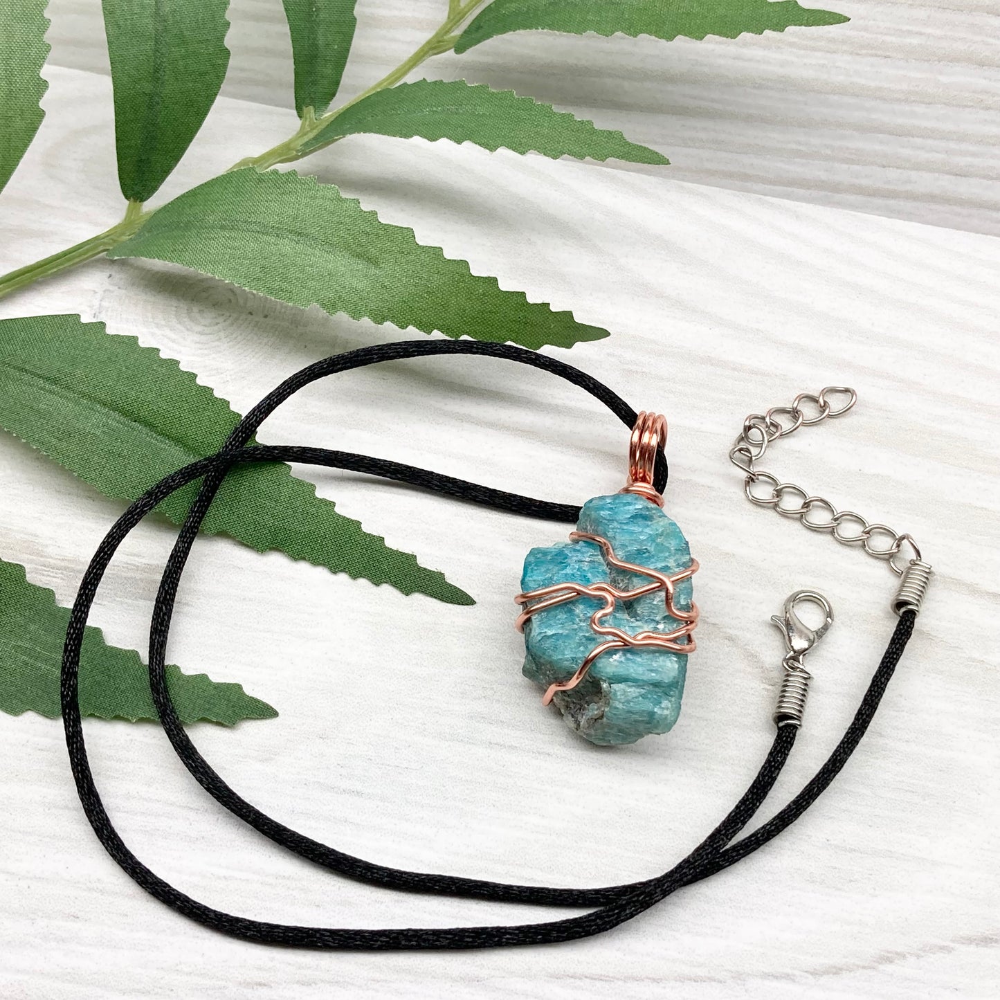 Blue Apatite Necklace. Raw Blue Apatite Stone Wrapped With Tarnish Resistant Copper Wire. This Pendant Was Handcrafted During The Moon In Scorpio. Comes On A Black Chain. Spiritual Jewelry For Him Or Her.