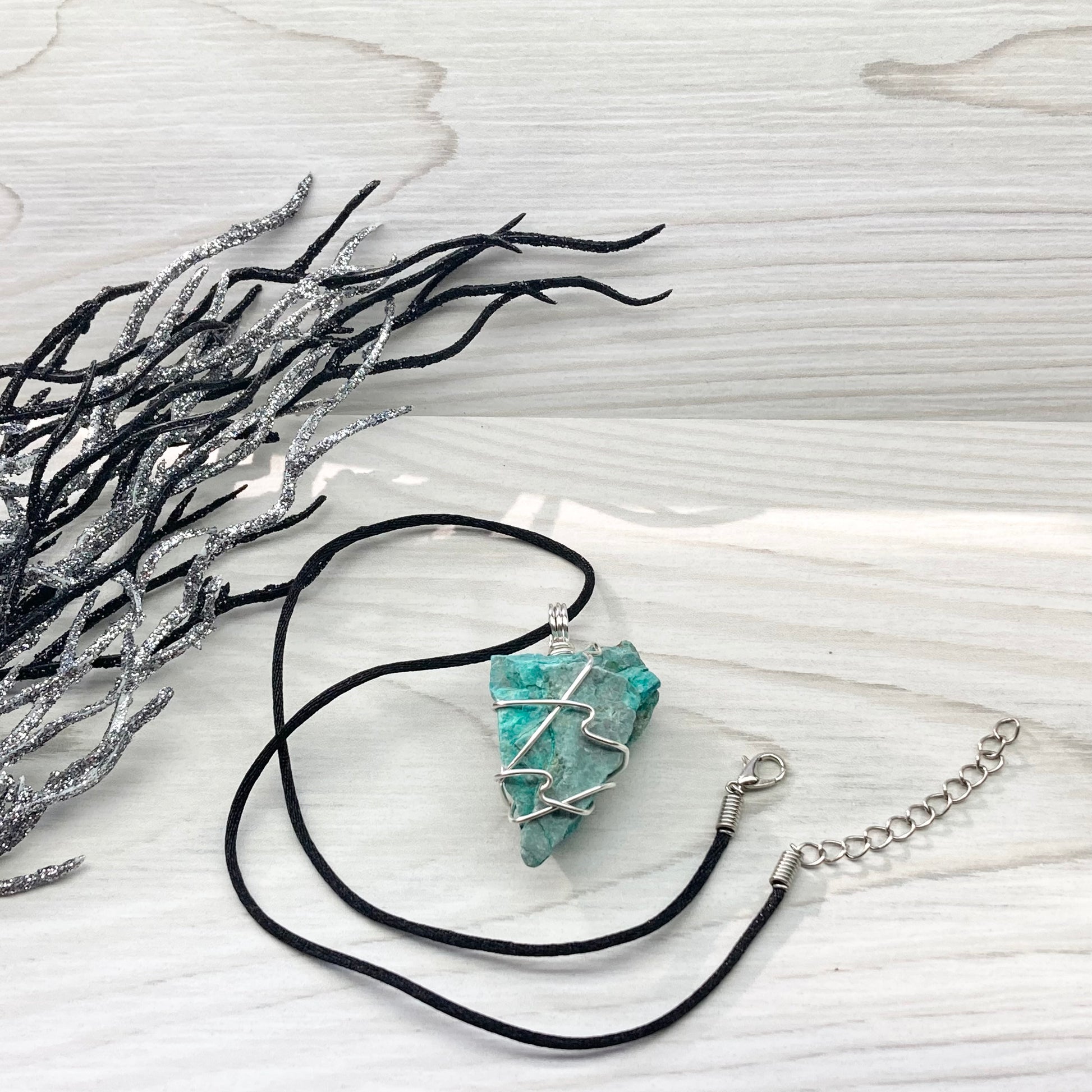 Chrysocolla Necklace. Raw Chrysocolla Crystal Wrapped With Silver Colored Copper Wire. This Stone Is A Beautiful Teal Color. Comes On A Black Chain.