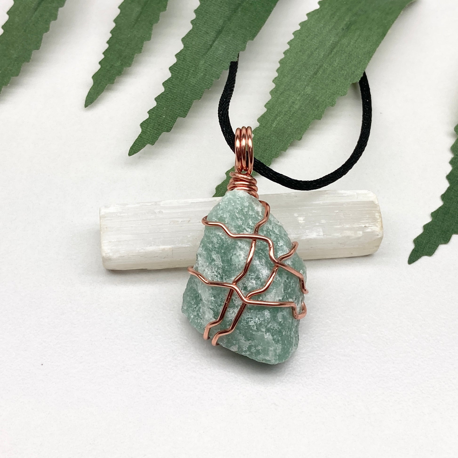 Green Aventurine necklace. Green stone wrapped with copper wire. Comes on a black chain. Hanfcrafted metaphysical jewelry.