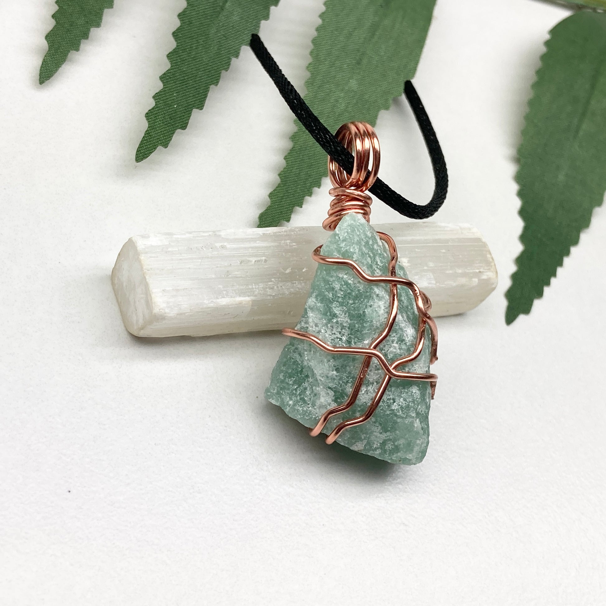 Green Aventurine necklace. Green stone wrapped with copper wire. Comes on a black chain. Hanfcrafted metaphysical jewelry.