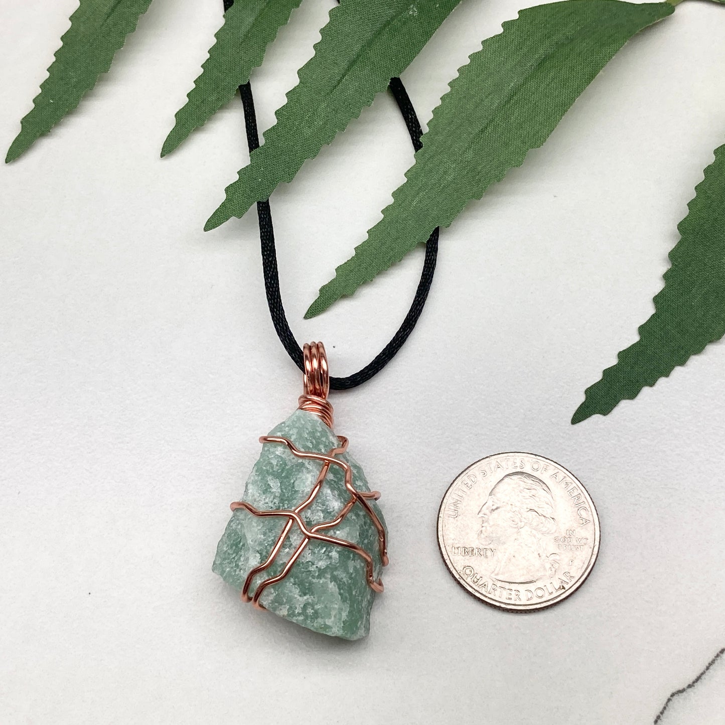 Green Aventurine necklace. Green stone wrapped with copper wire. Comes on a black chain. Hanfcrafted metaphysical jewelry.
