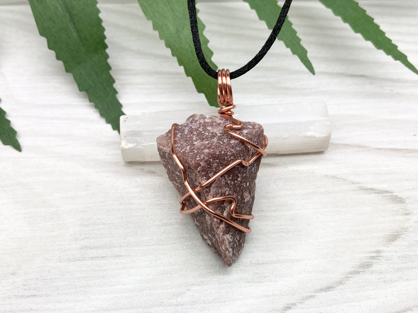 Natural Guava Quartz Necklace. This Crystal Is Hand Wrapped With Copper Wire. Stone is a Purple Brown Color. Comes On A Black Chain. Peace And Harmony Gemstone.