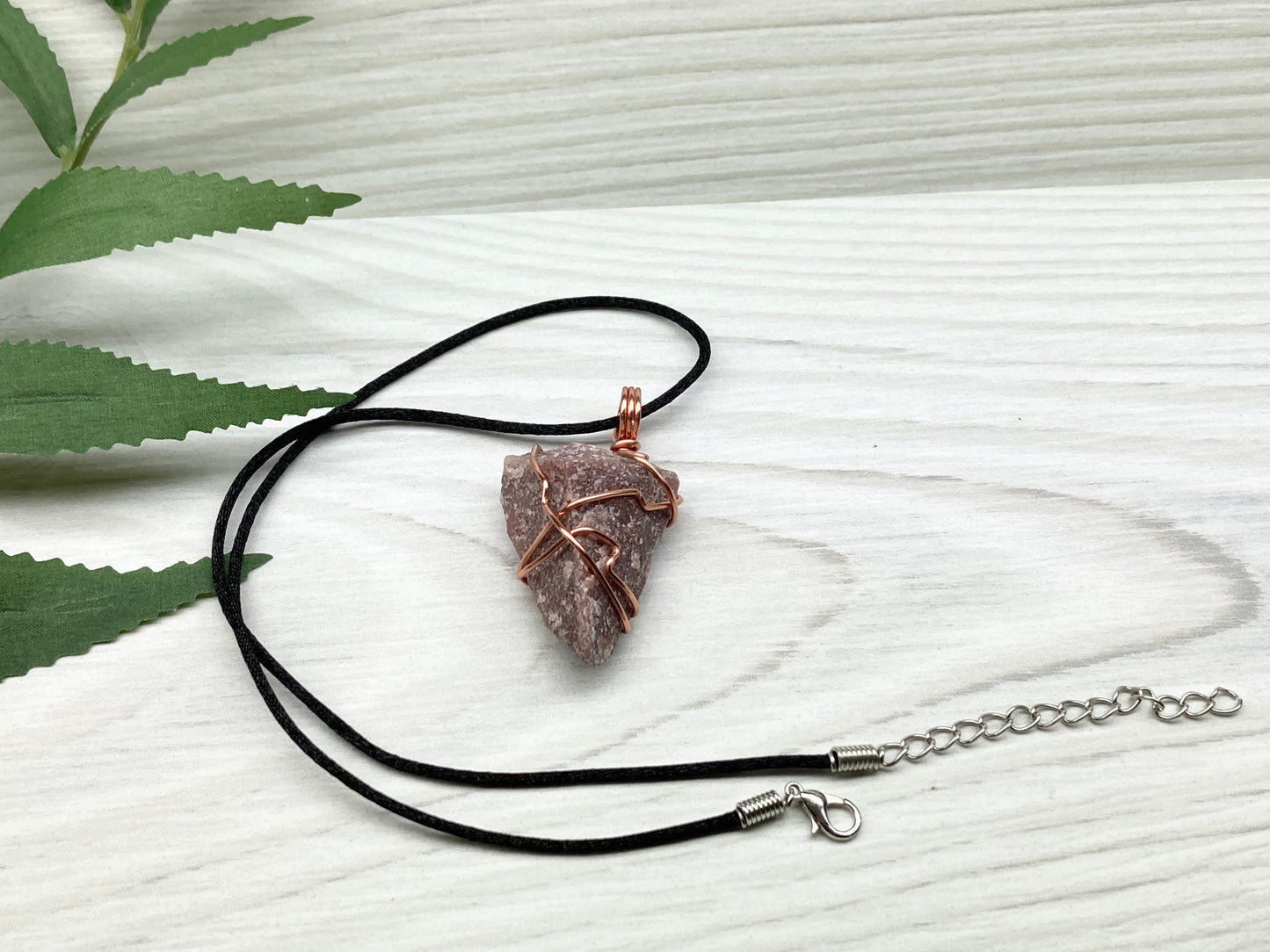 Natural Guava Quartz Necklace. This Crystal Is Hand Wrapped With Copper Wire. Stone is a Purple Brown Color. Comes On A Black Chain. Peace And Harmony Gemstone.