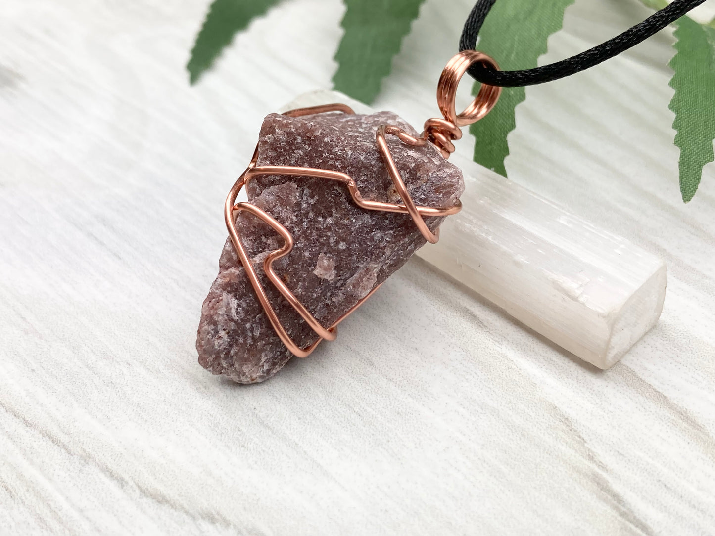 Natural Guava Quartz Necklace. This Crystal Is Hand Wrapped With Copper Wire. Stone is a Purple Brown Color. Comes On A Black Chain. Peace And Harmony Gemstone.