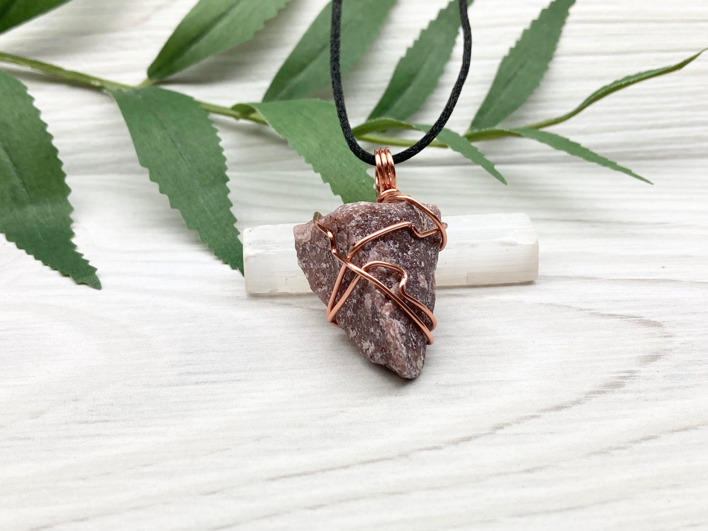 Natural Guava Quartz Necklace. This Crystal Is Hand Wrapped With Copper Wire. Stone is a Purple Brown Color. Comes On A Black Chain. Peace And Harmony Gemstone.