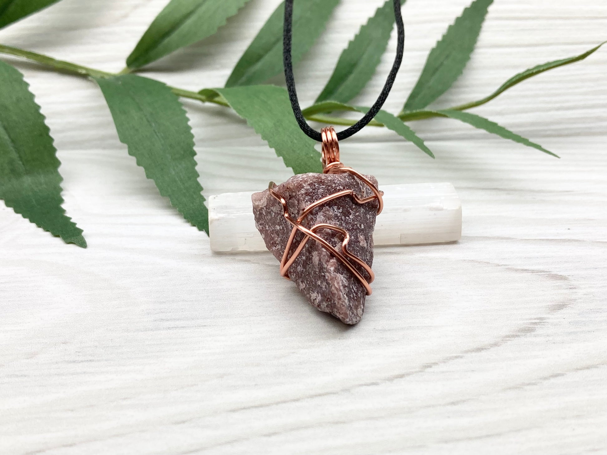Natural Guava Quartz Necklace. This Crystal Is Hand Wrapped With Copper Wire. Stone is a Purple Brown Color. Comes On A Black Chain. Peace And Harmony Gemstone.