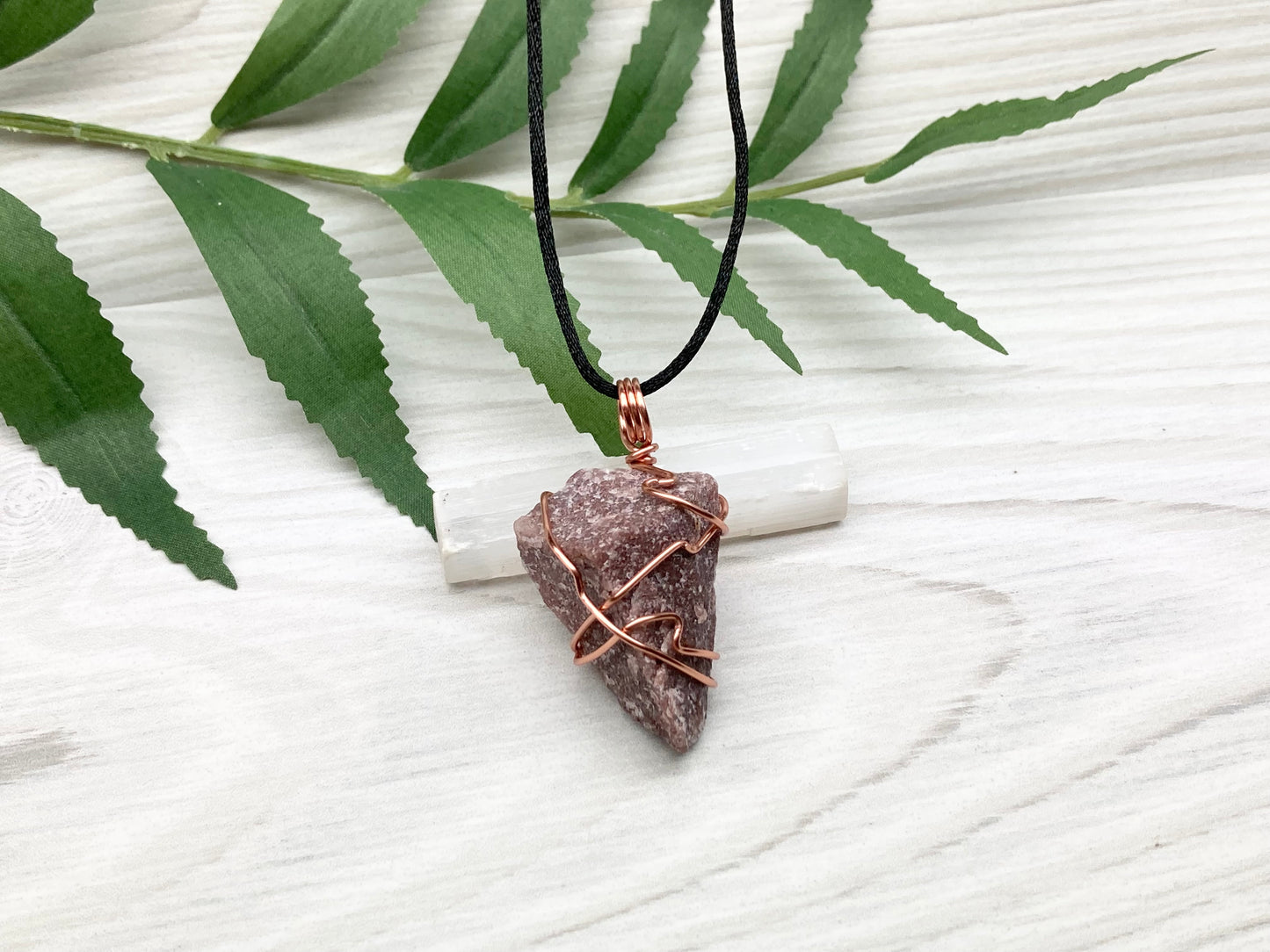 Natural Guava Quartz Necklace. This Crystal Is Hand Wrapped With Copper Wire. Stone is a Purple Brown Color. Comes On A Black Chain. Peace And Harmony Gemstone.