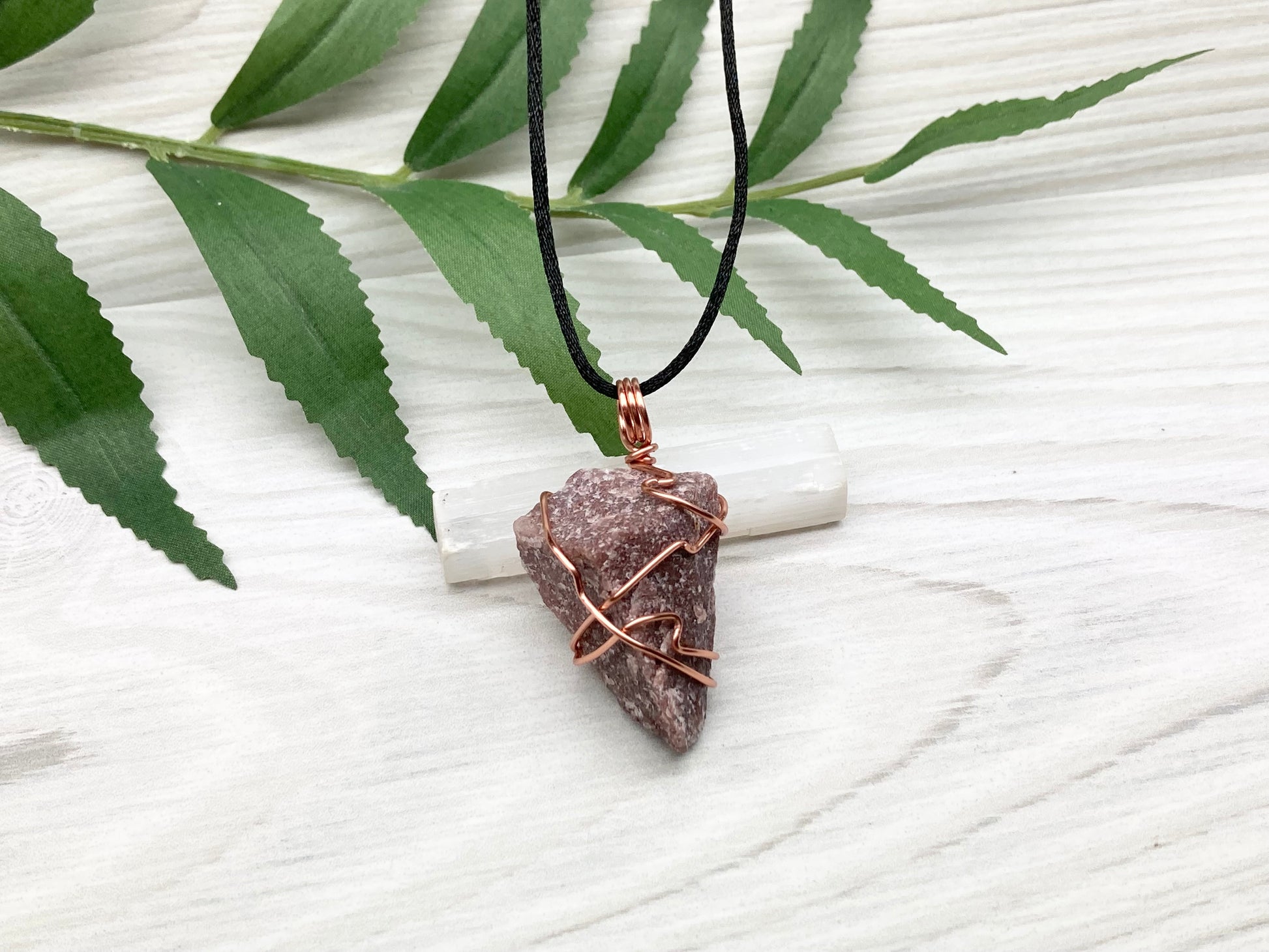 Natural Guava Quartz Necklace. This Crystal Is Hand Wrapped With Copper Wire. Stone is a Purple Brown Color. Comes On A Black Chain. Peace And Harmony Gemstone.