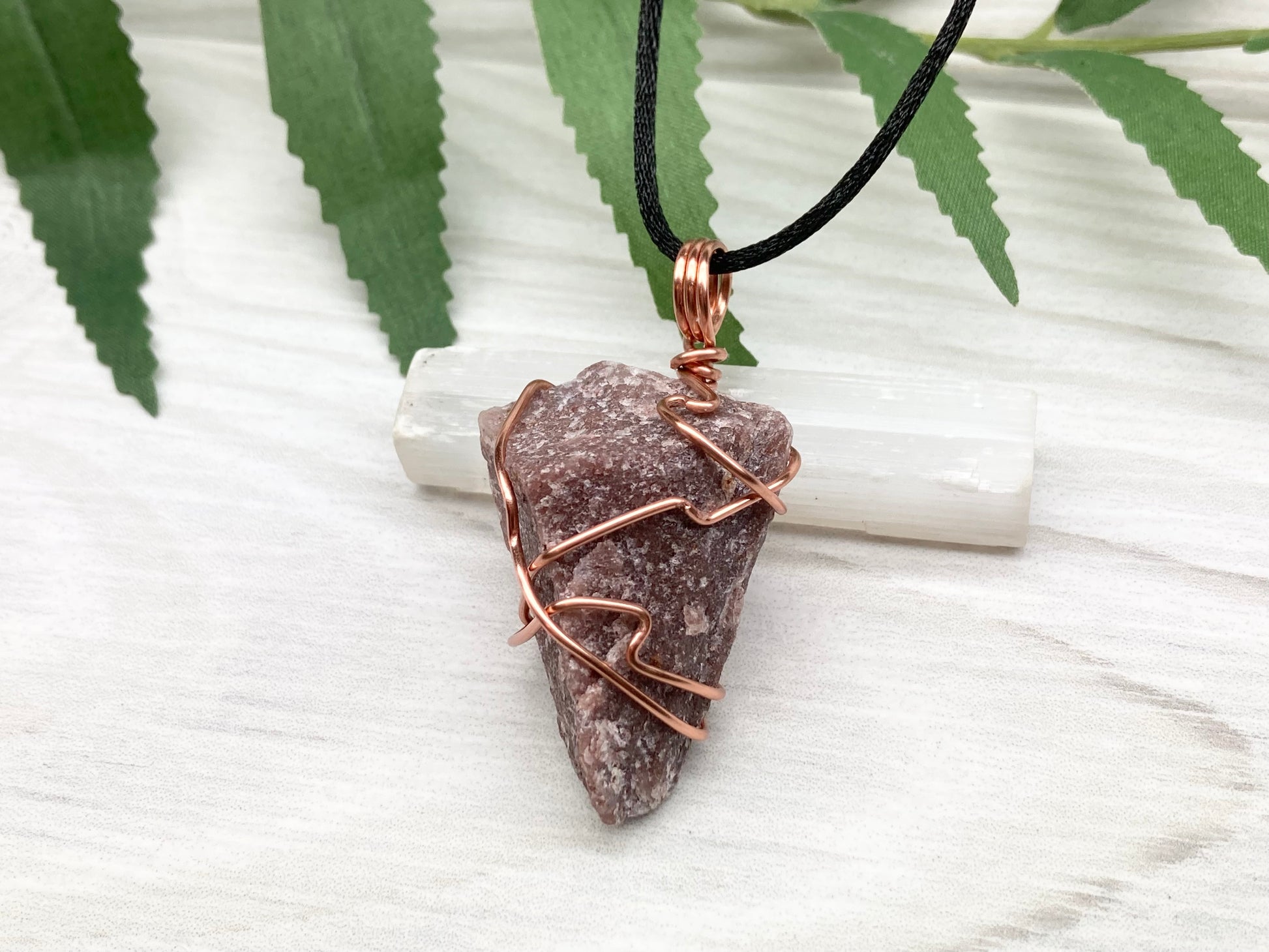 Natural Guava Quartz Necklace. This Crystal Is Hand Wrapped With Copper Wire. Stone is a Purple Brown Color. Comes On A Black Chain. Peace And Harmony Gemstone.