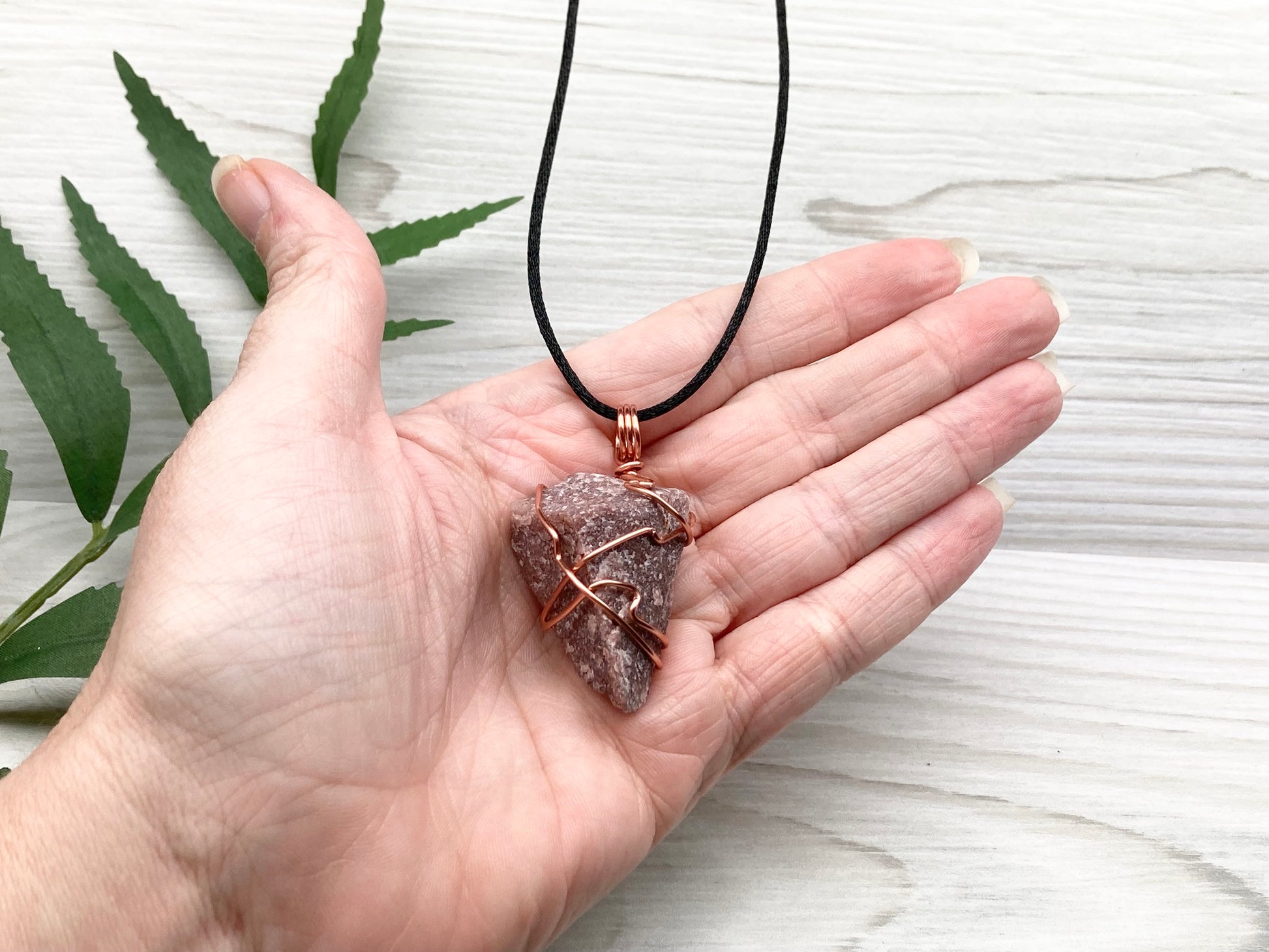 Natural Guava Quartz Necklace. This Crystal Is Hand Wrapped With Copper Wire. Stone is a Purple Brown Color. Comes On A Black Chain. Peace And Harmony Gemstone.