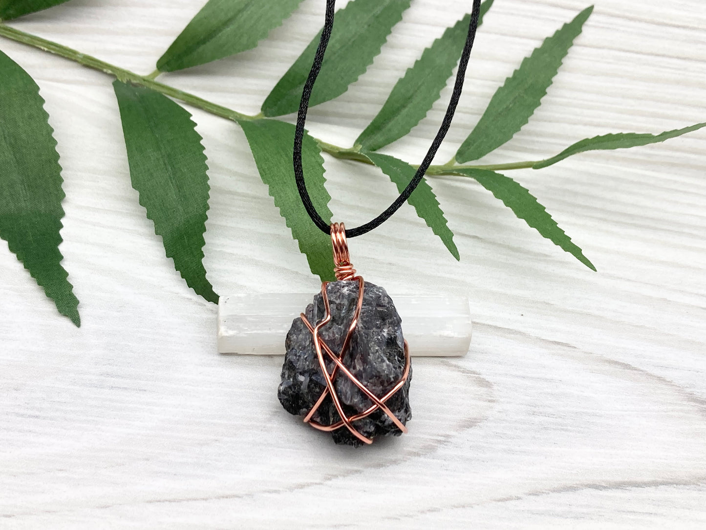 Indigo Gabbro Stone Necklace. Indigo Gabbro Crystal Wrapped With Tarnish Resistant Copper Wire. Also Known As Mystic Merlinite. Comes On A Black Chain. 