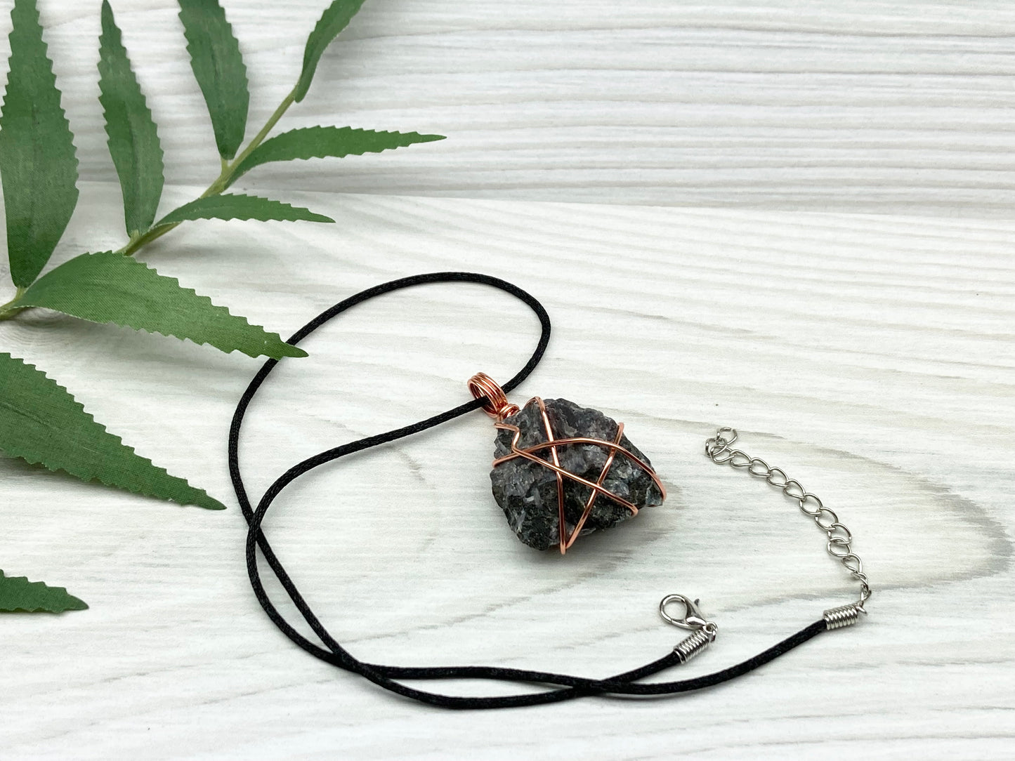 Indigo Gabbro Stone Necklace. Indigo Gabbro Crystal Wrapped With Tarnish Resistant Copper Wire. Also Known As Mystic Merlinite. Comes On A Black Chain. 