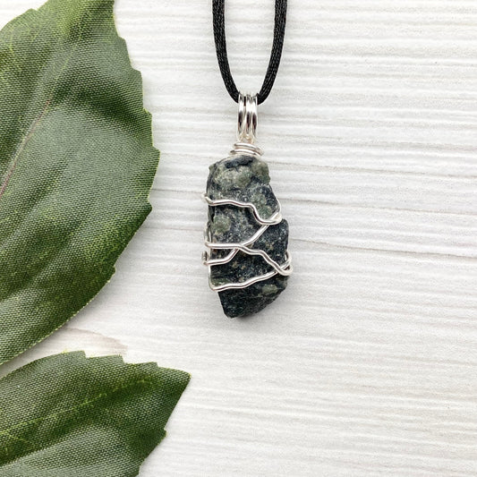 Kambaba Jasper necklace. Raw Kambaba Jasper stone wrapped with silver colored copper wire. Hangs on a black satin silk chain. Wire wrapped green and black crystal  copper pendant. Handcrafted metaphysical jewelry.