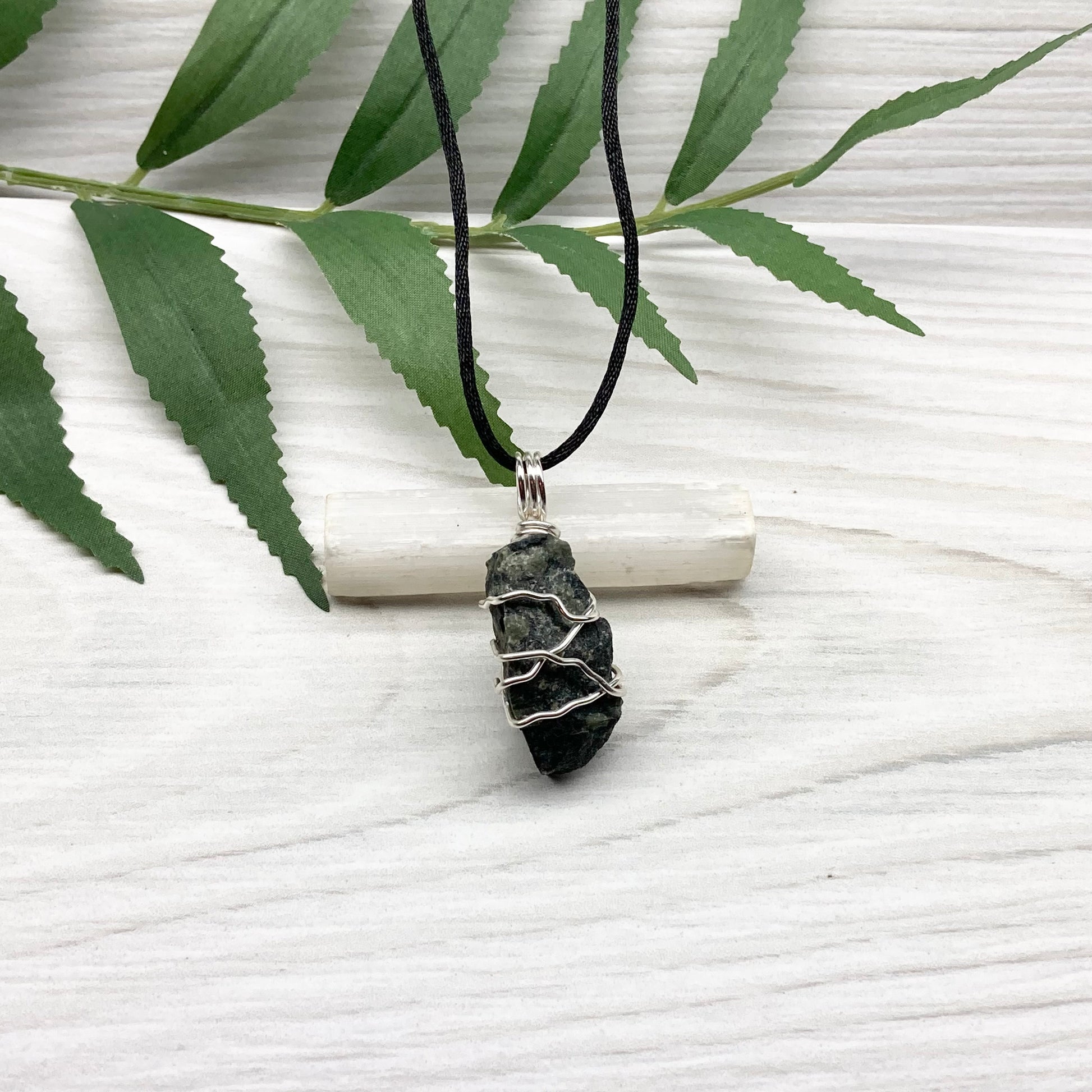 Kambaba Jasper necklace. Raw Kambaba Jasper stone wrapped with silver colored copper wire. Hangs on a black satin silk chain. Wire wrapped green and black crystal  copper pendant. Handcrafted metaphysical jewelry.