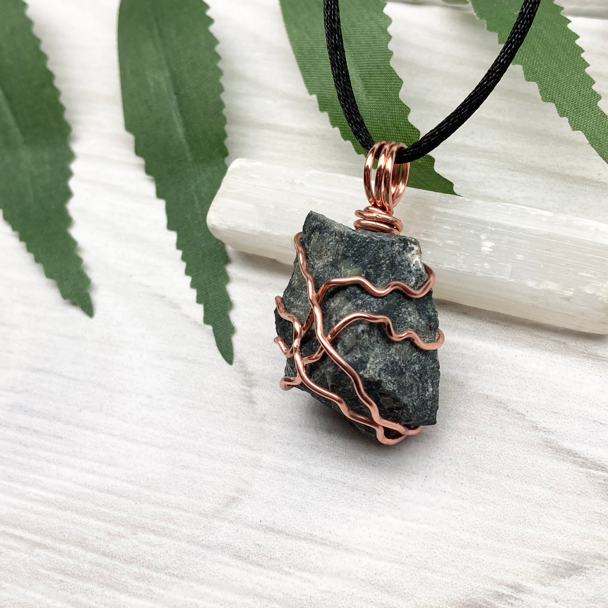 Raw Kambaba Jasper Necklace. Black and green stone wrapped with tarnish resistant copper wire. Comes on a black chain. Real crystal pendant. Wire wrapped jewelry. Handmade witchy gift.