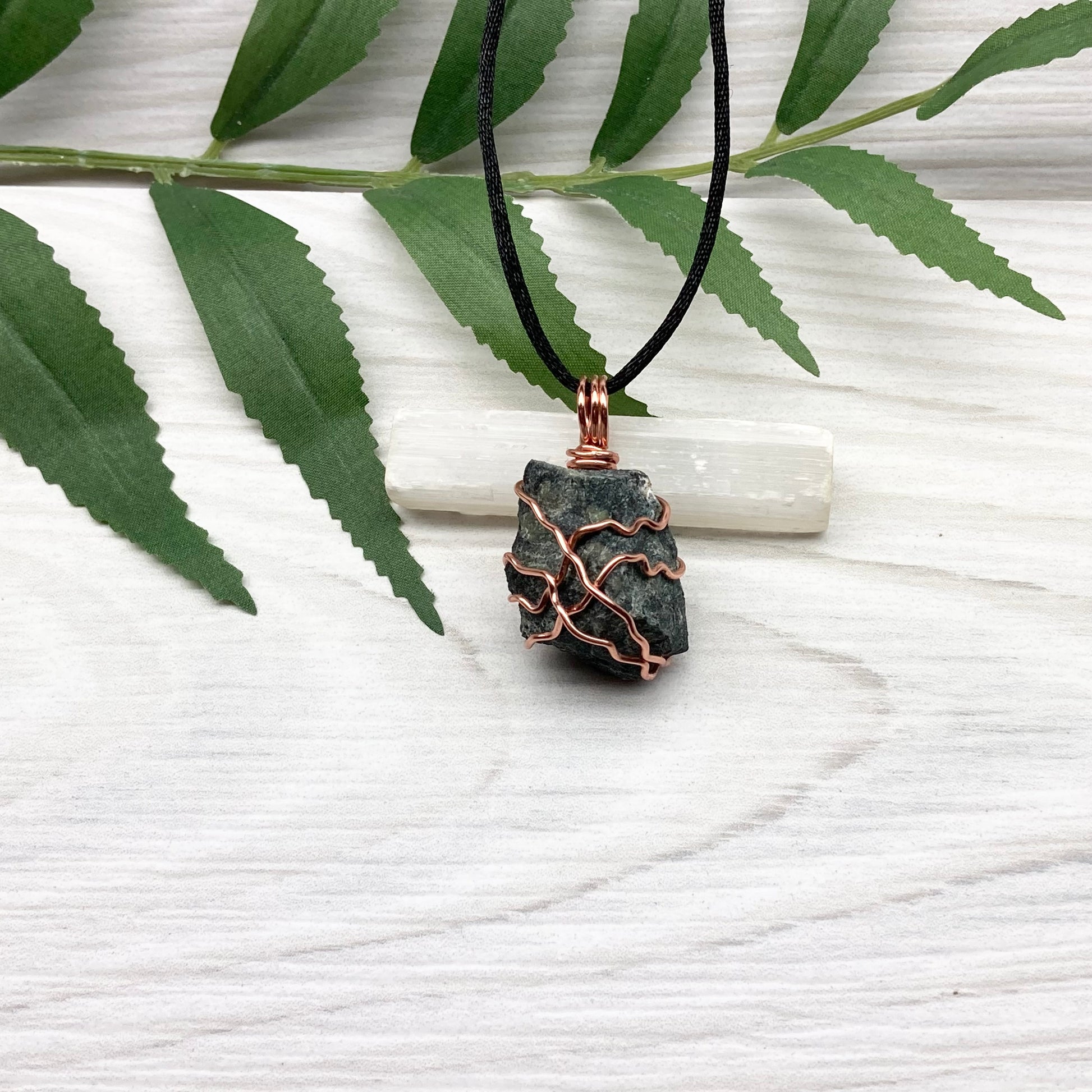 Raw Kambaba Jasper Necklace. Black and green stone wrapped with tarnish resistant copper wire. Comes on a black chain. Real crystal pendant. Wire wrapped jewelry. Handmade witchy gift.