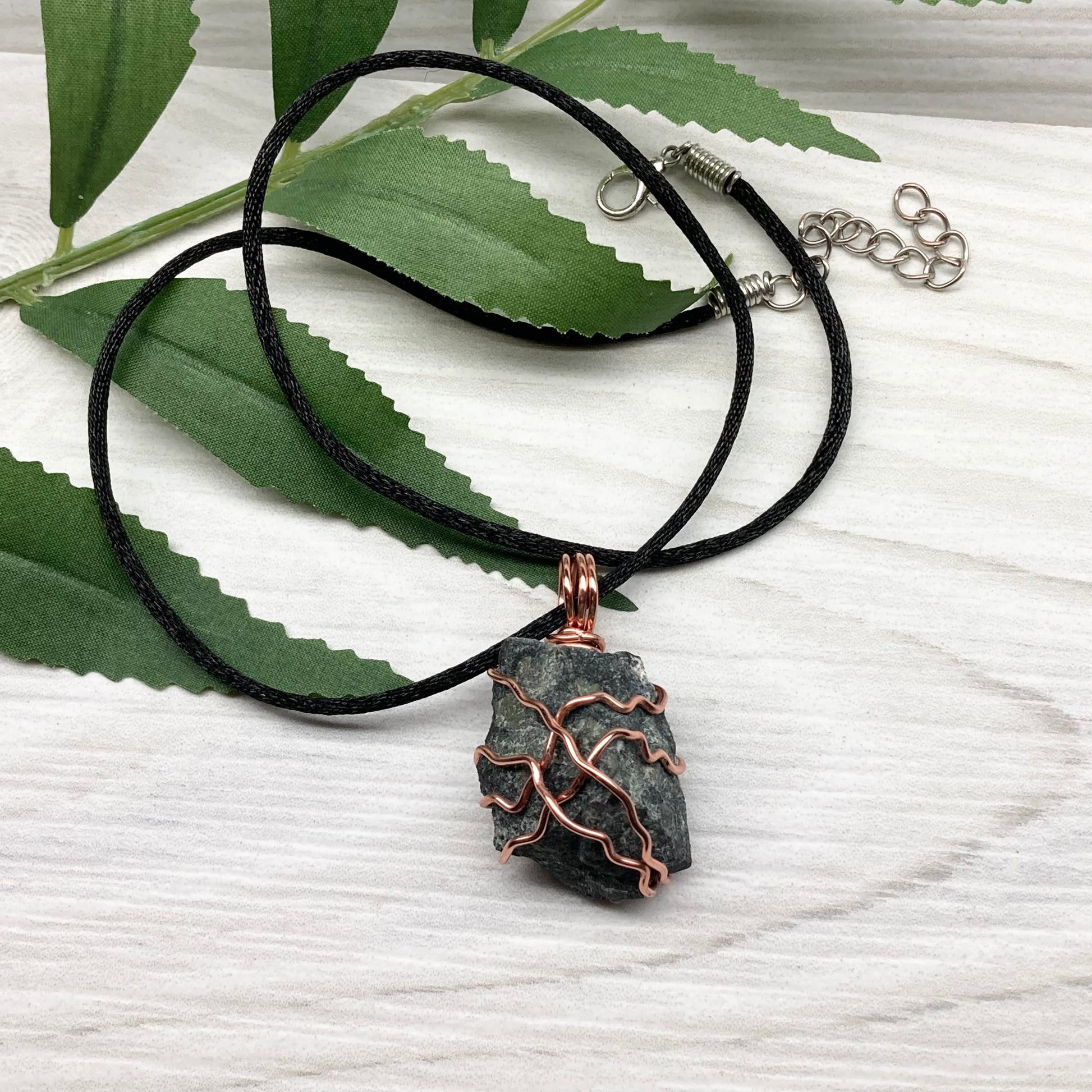 Raw Kambaba Jasper Necklace. Black and green stone wrapped with tarnish resistant copper wire. Comes on a black chain. Real crystal pendant. Wire wrapped jewelry. Handmade witchy gift.