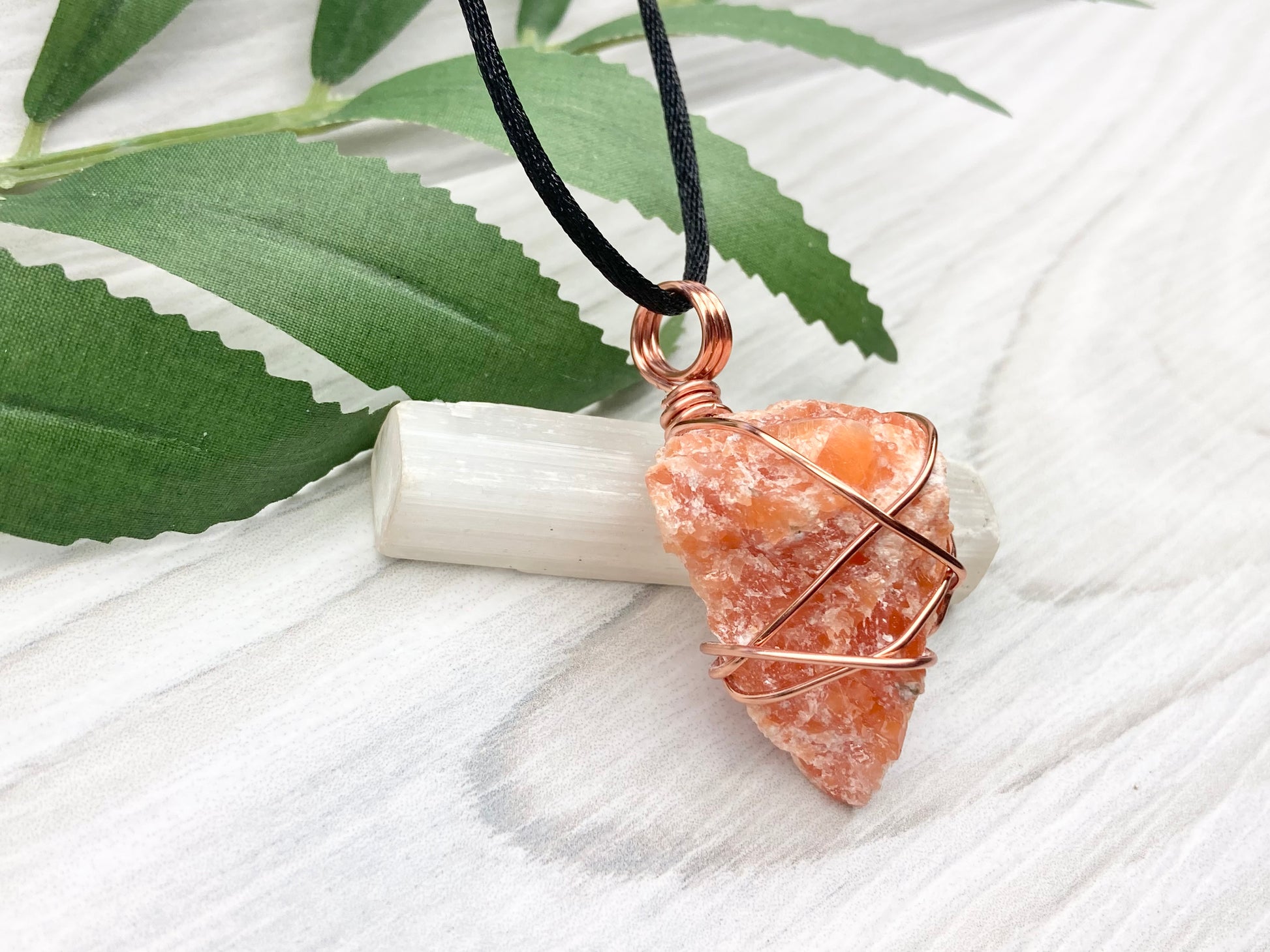 Orange Calcite Necklace. Raw Orange Calcite Crystal Wrapped With Copper Wire That Is Tarnish Resistant. Comes On A Black Necklace. Gemini Zodiac Stone Pendant. Handmade In Tennessee. Pagan Spiritual Jewelry.