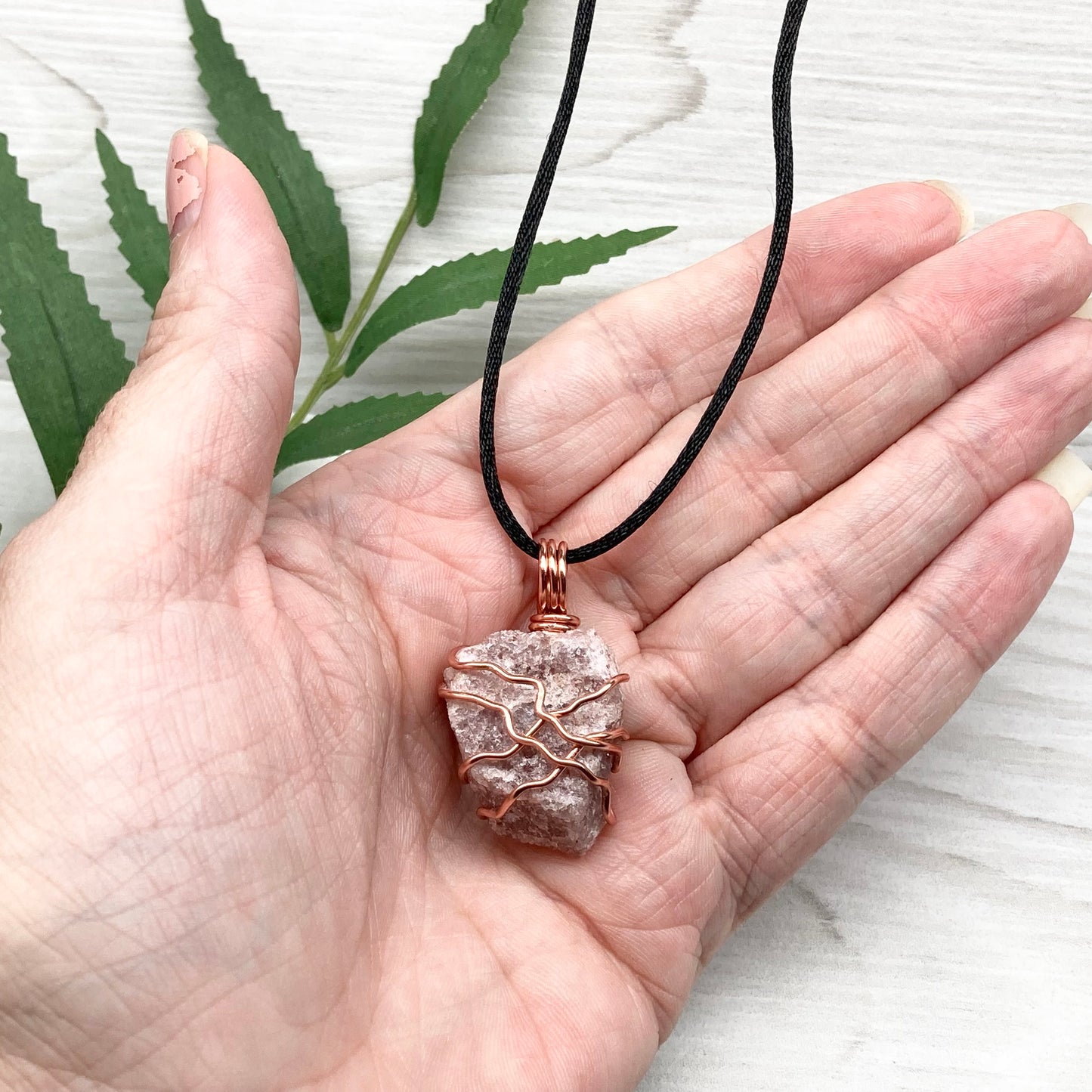 Pink Aventurine Necklace. Raw pink stone wrapped with tarnish resistant copper wire. Comes on a black chain. Wire wrapped crystal pendant. Heart chakra Jewelry. 