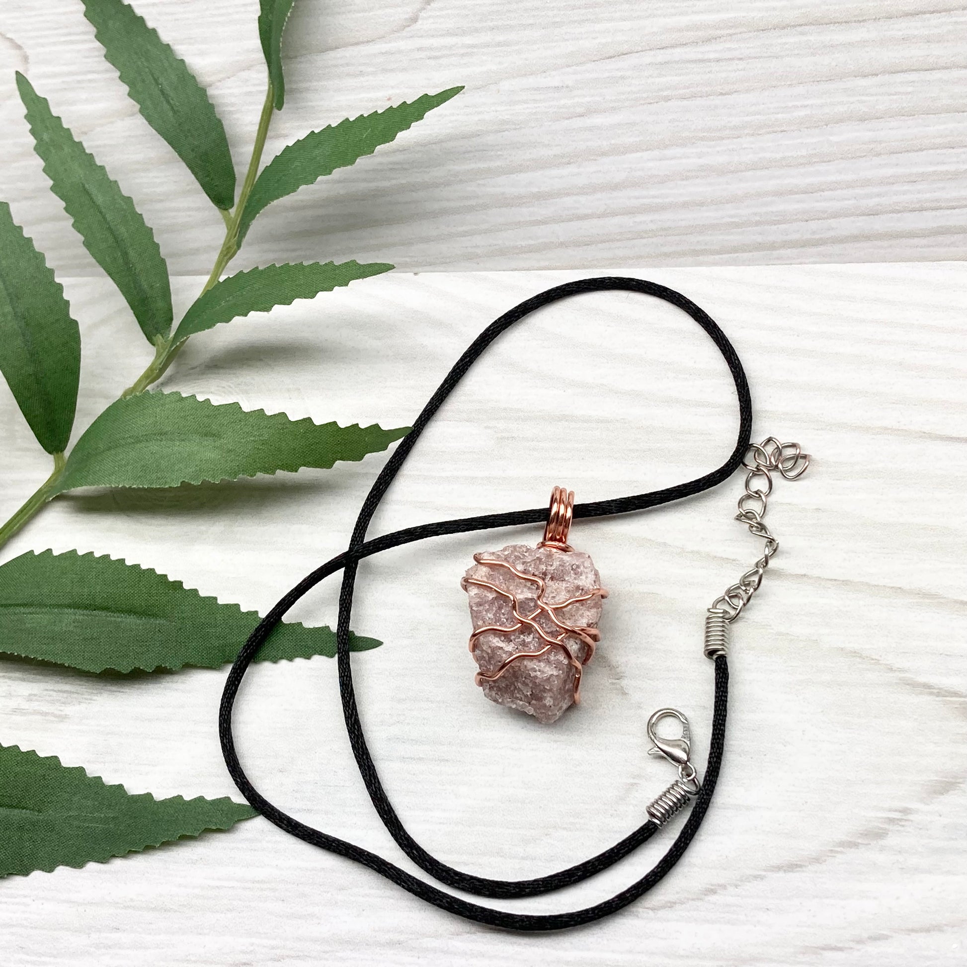 Pink Aventurine Necklace. Raw pink stone wrapped with tarnish resistant copper wire. Comes on a black chain. Wire wrapped crystal pendant. Heart chakra Jewelry. 