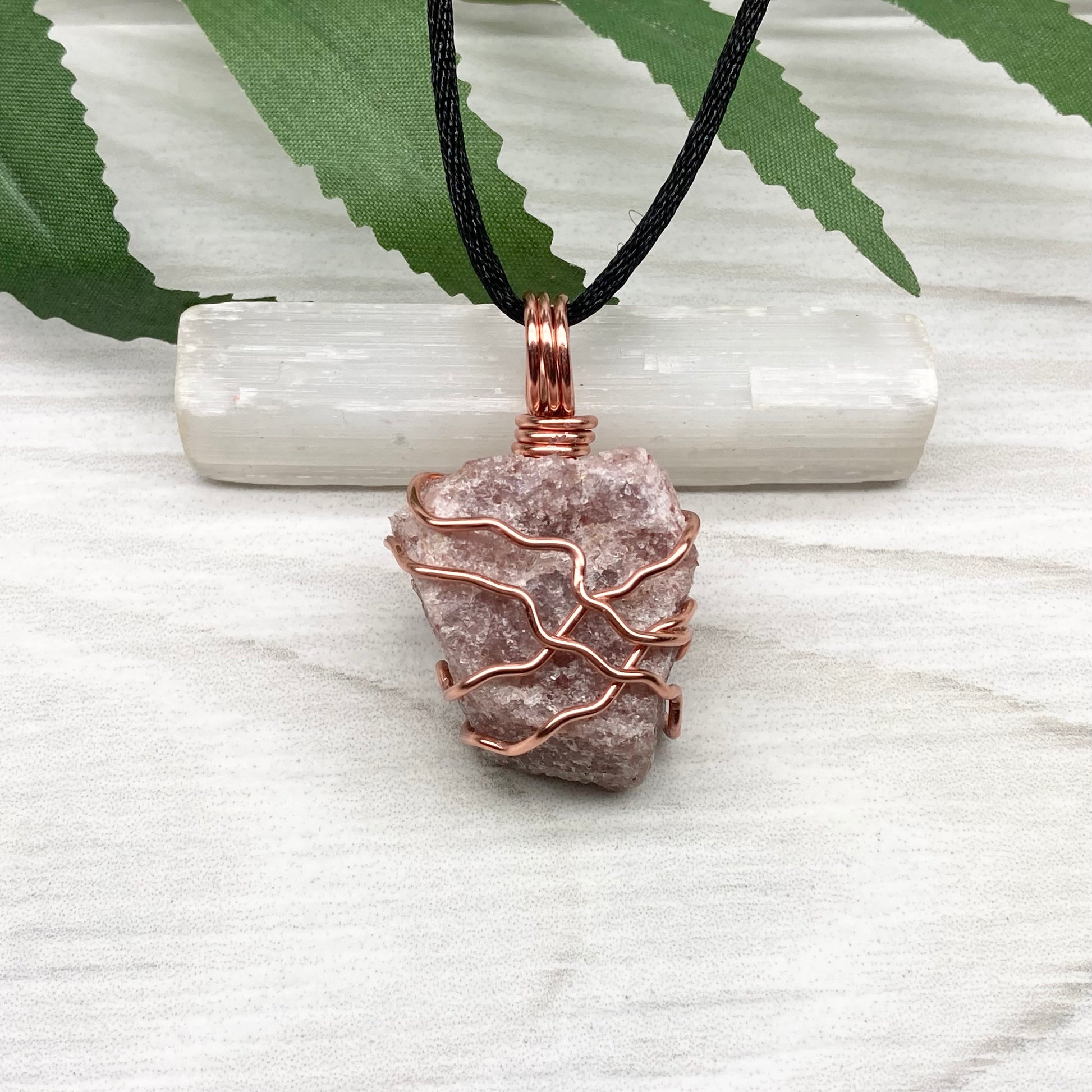 Pink Aventurine Necklace. Raw pink stone wrapped with tarnish resistant copper wire. Comes on a black chain. Wire wrapped crystal pendant. Heart chakra Jewelry. 