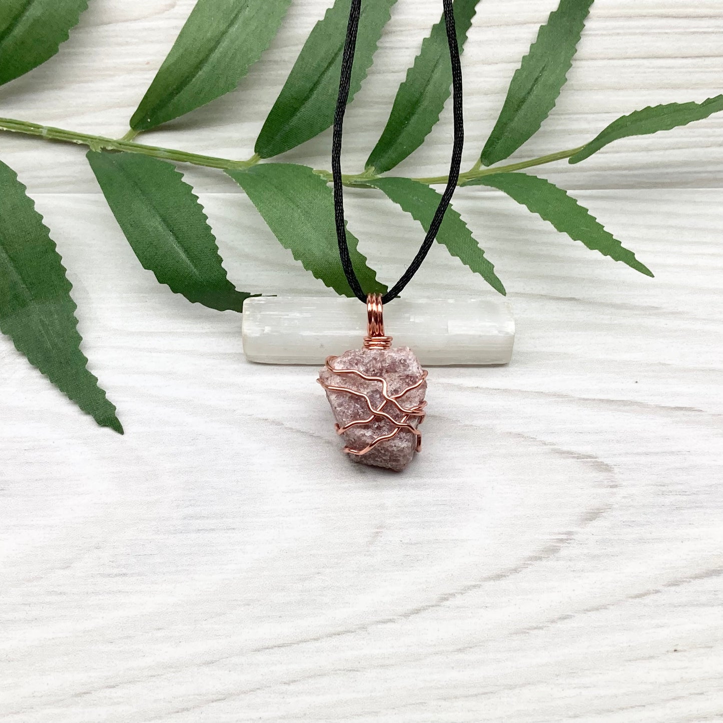 Pink Aventurine Necklace. Raw pink stone wrapped with tarnish resistant copper wire. Comes on a black chain. Wire wrapped crystal pendant. Heart chakra Jewelry. 