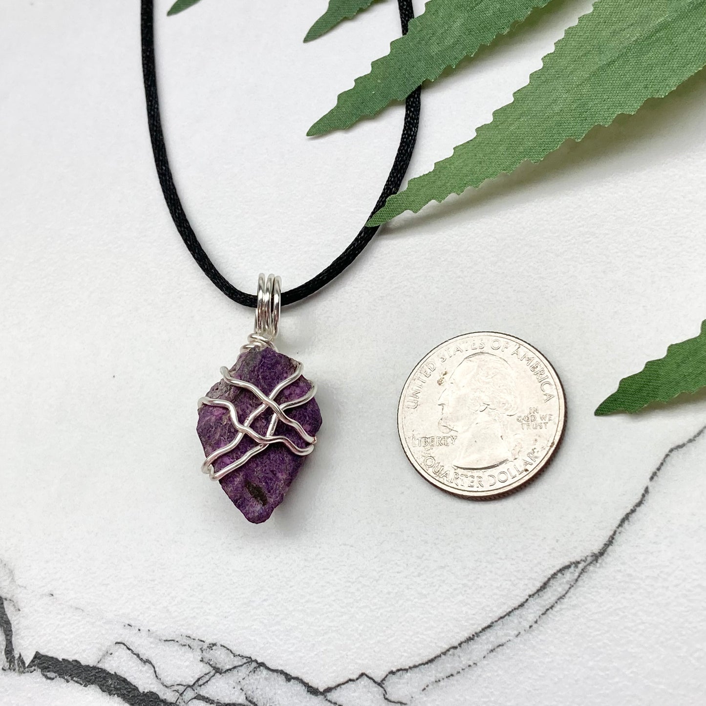 Purpurite necklace. Raw purple Purpurite stone wrapped with silver colored copper wire. Hangs on a black chain. Raw real crystal pendant.