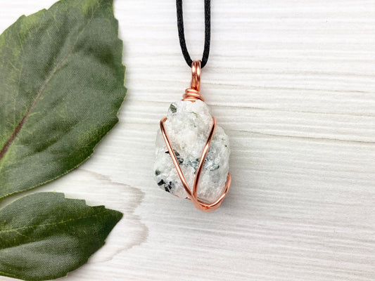 Rainbow Moonstone Necklace. White And Black Crystal Wrapped With Copper Wire. Comes On A Black Chain. This Stone Is Associated With The Third Eye Chakra.