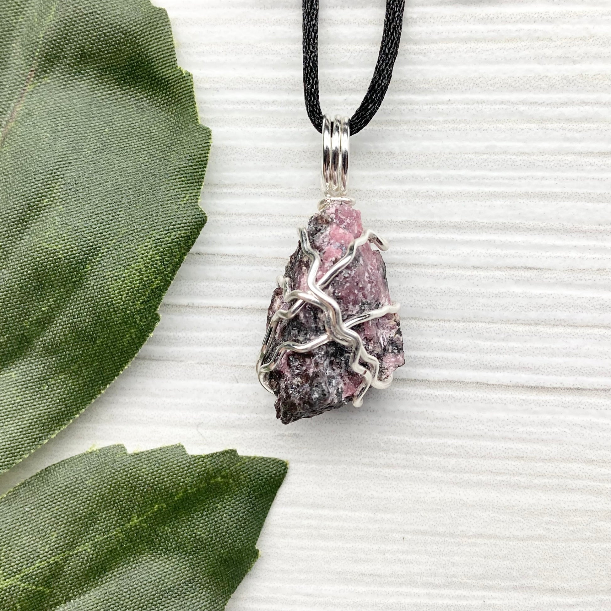 Rhodonite necklace. Raw Rhodonite wrapped with silver copper wire. Comes on a black chain. Black and pink crystal pendant. Wire wrapped stone jewelry. Taurus zodiac gift.